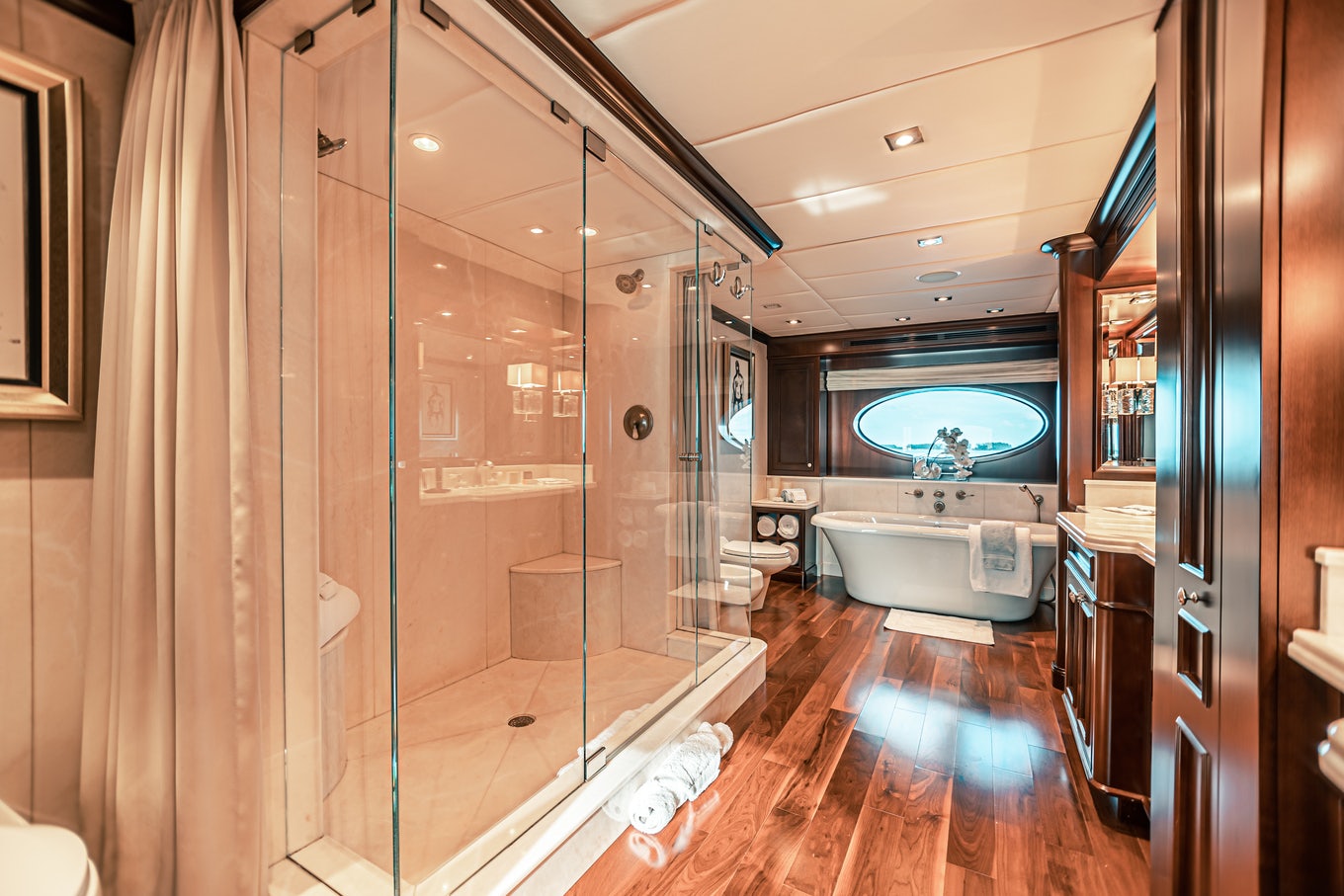 a bathroom with a large glass shower aboard MIRABELLA Yacht for Sale