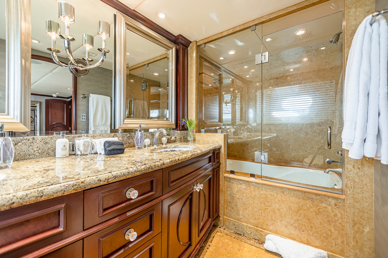 a bathroom with a large mirror aboard MIRABELLA Yacht for Sale