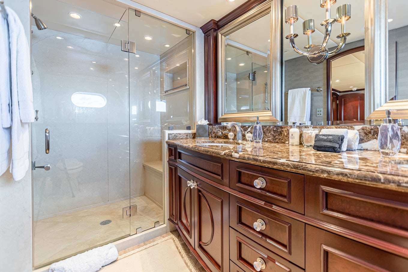 a bathroom with a glass shower aboard MIRABELLA Yacht for Sale