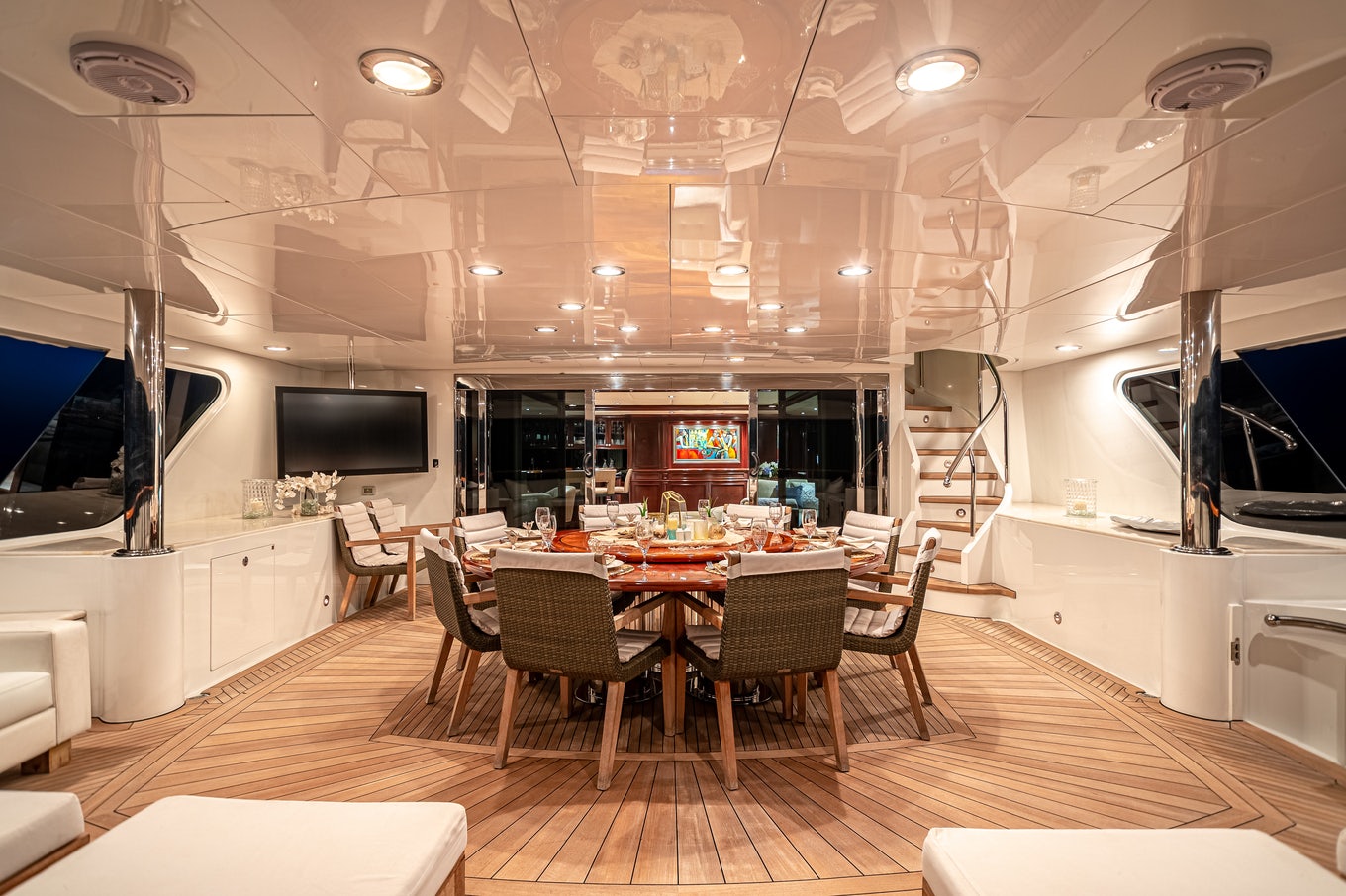 a room with tables and chairs aboard MIRABELLA Yacht for Sale