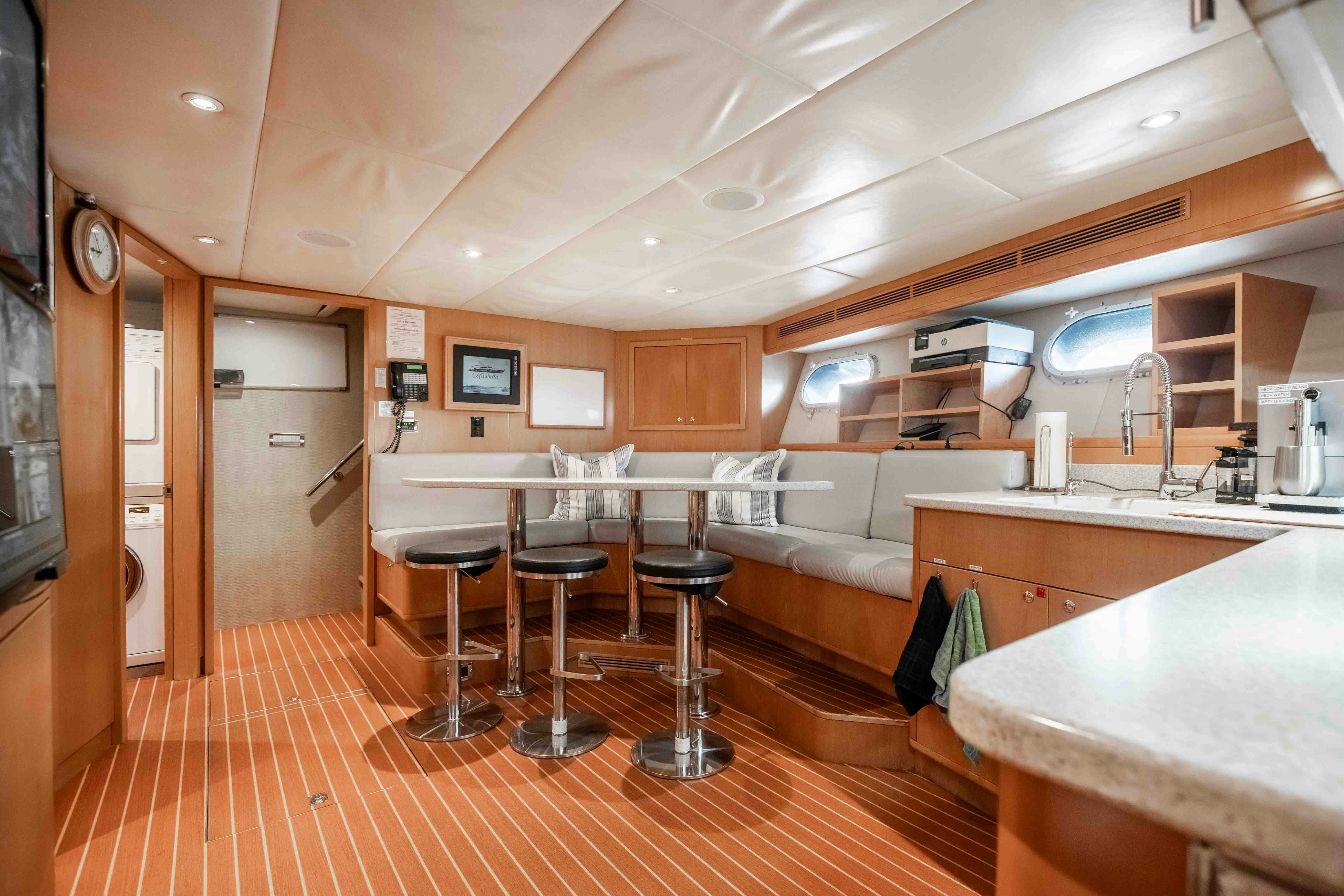 a kitchen and living room aboard MIRABELLA Yacht for Sale