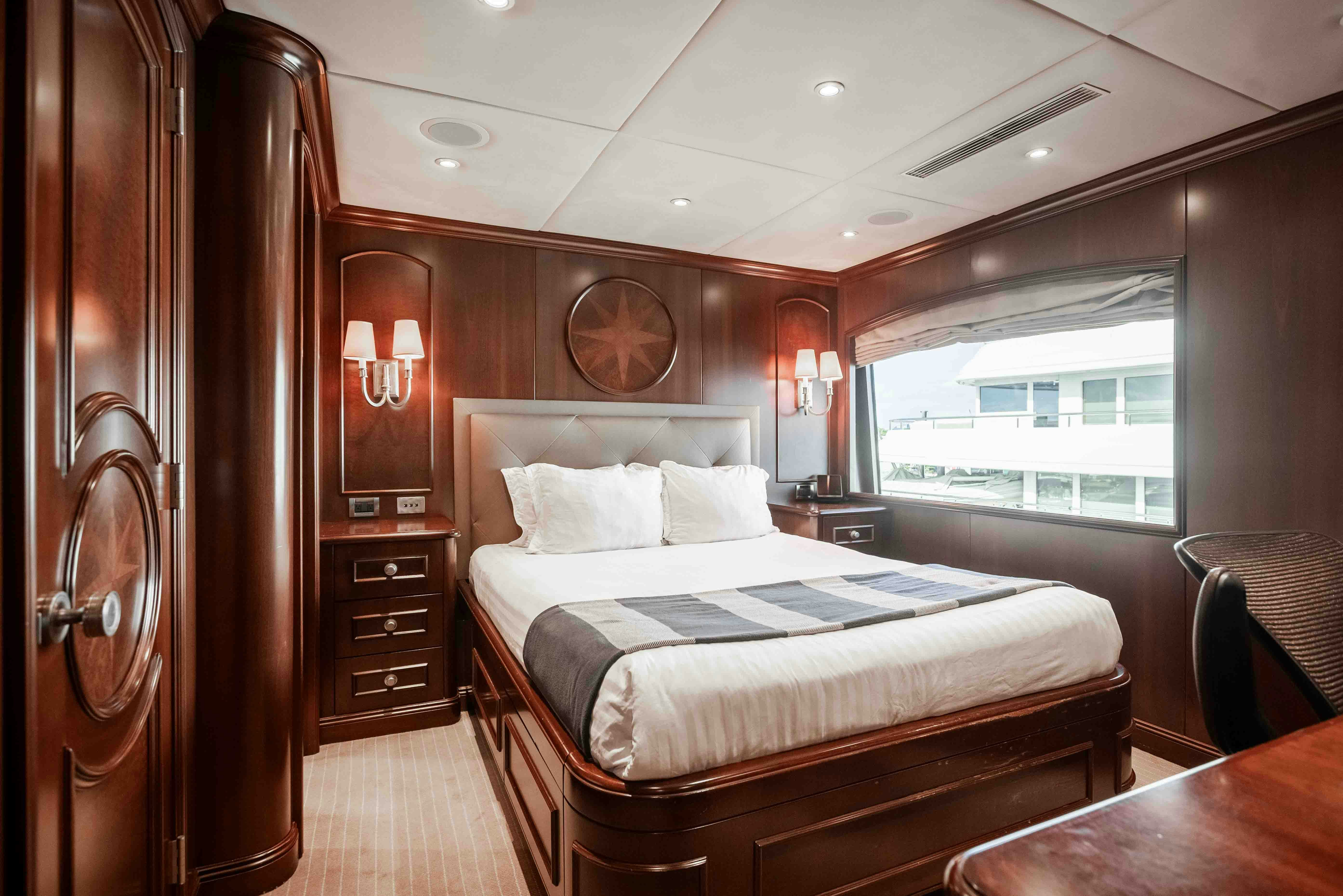 a bed in a room aboard MIRABELLA Yacht for Sale