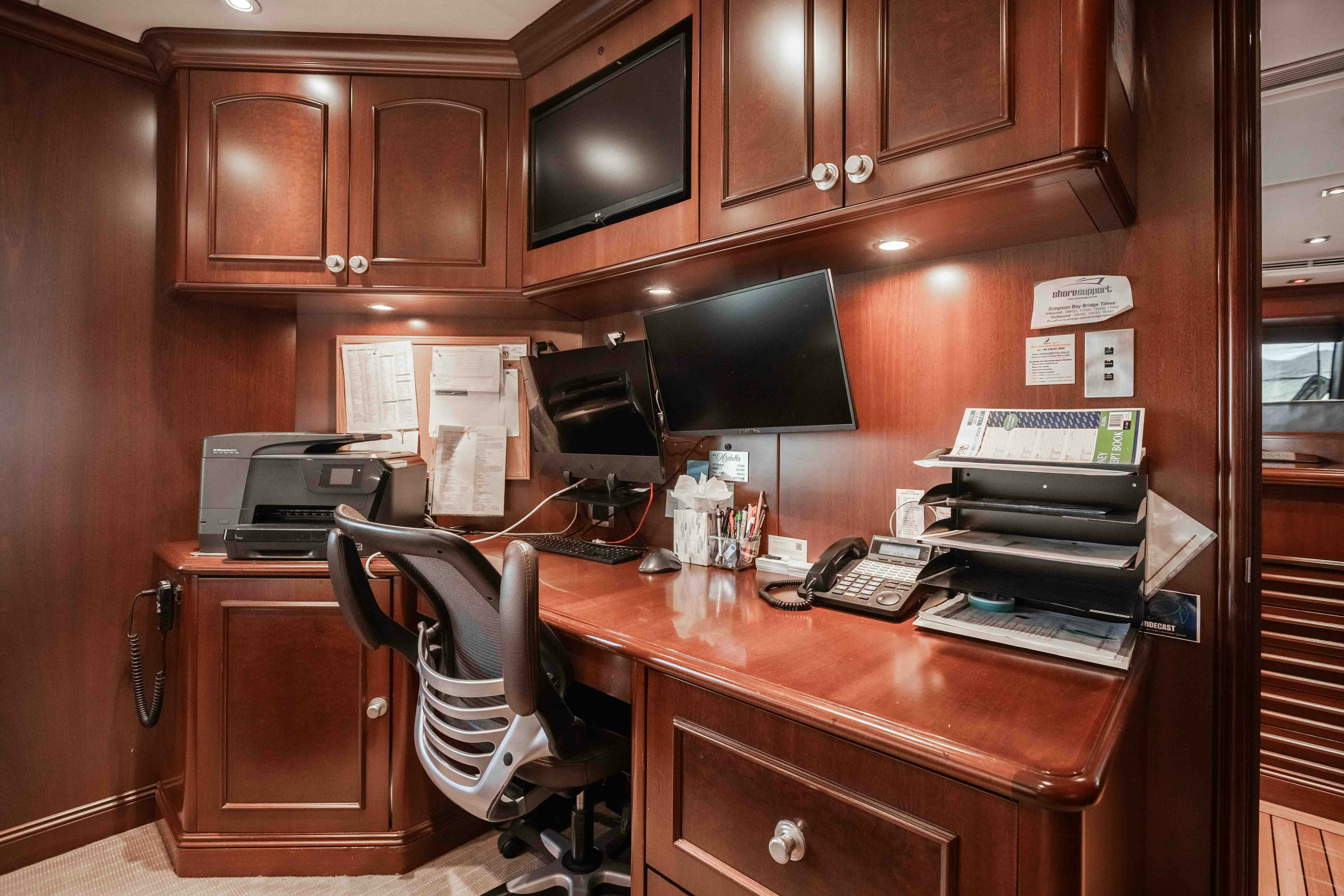 a desk with a computer and a printer on it aboard MIRABELLA Yacht for Sale
