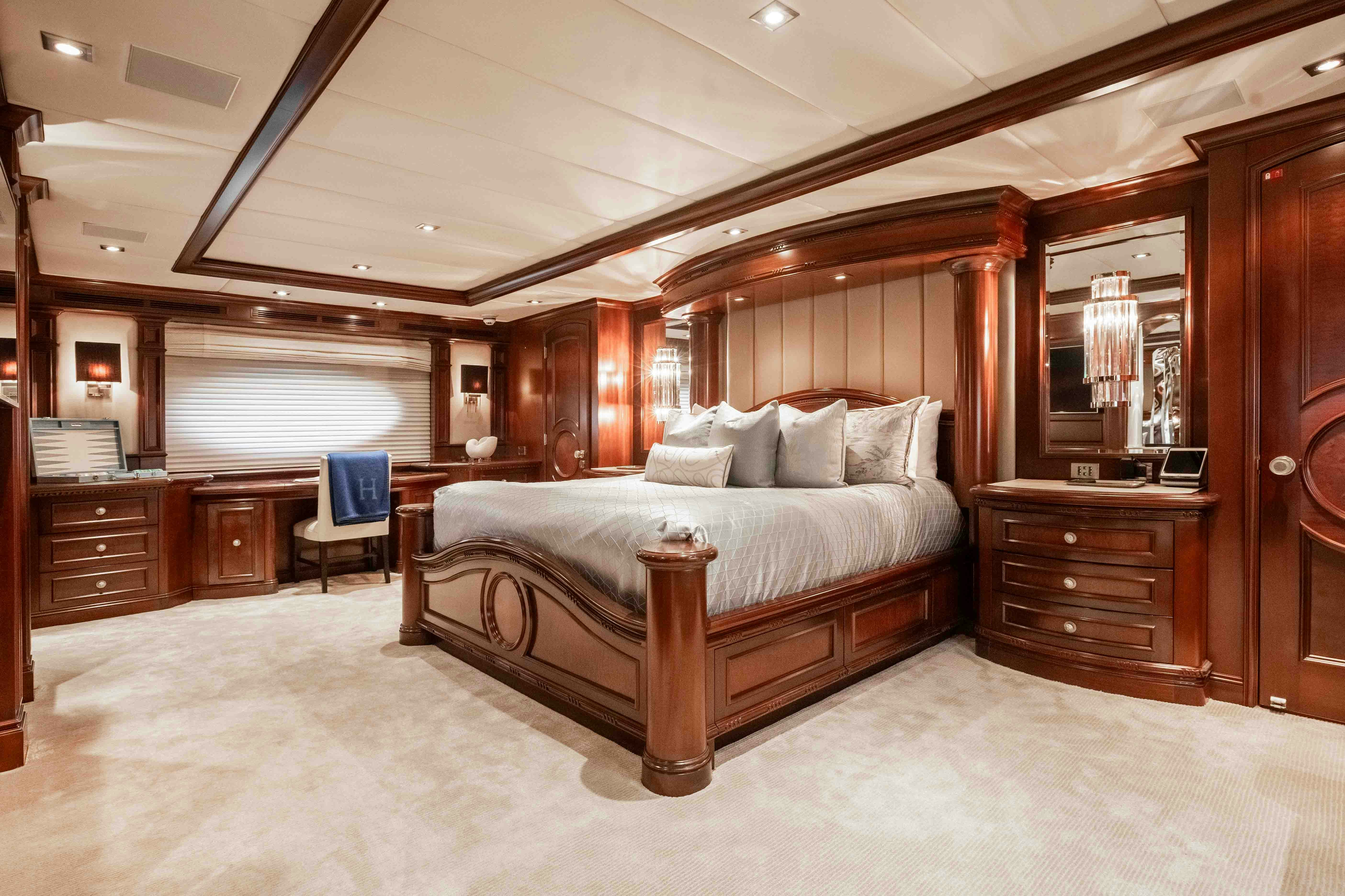 a large bed in a room aboard MIRABELLA Yacht for Sale