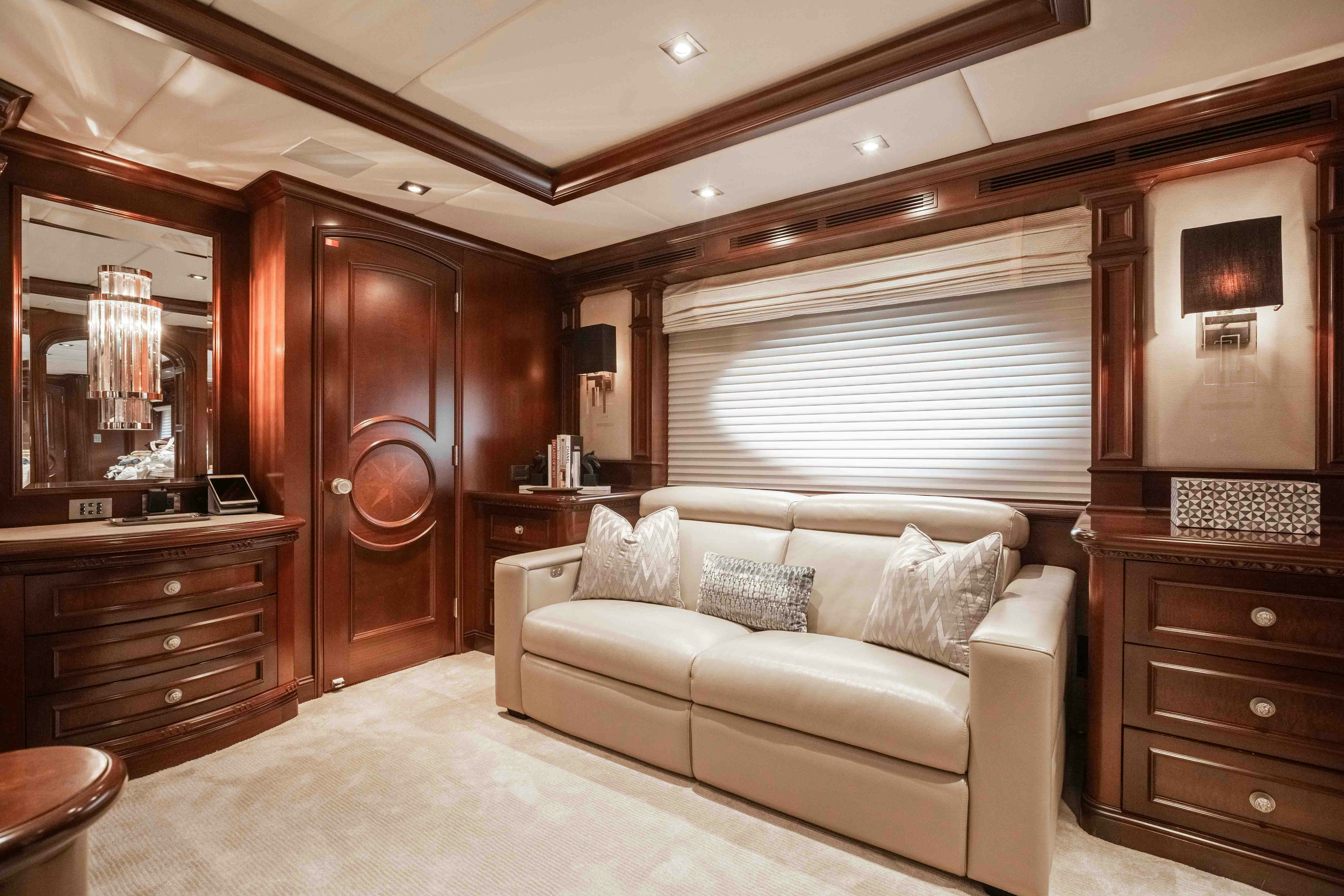 a living room with a couch and a television aboard MIRABELLA Yacht for Sale