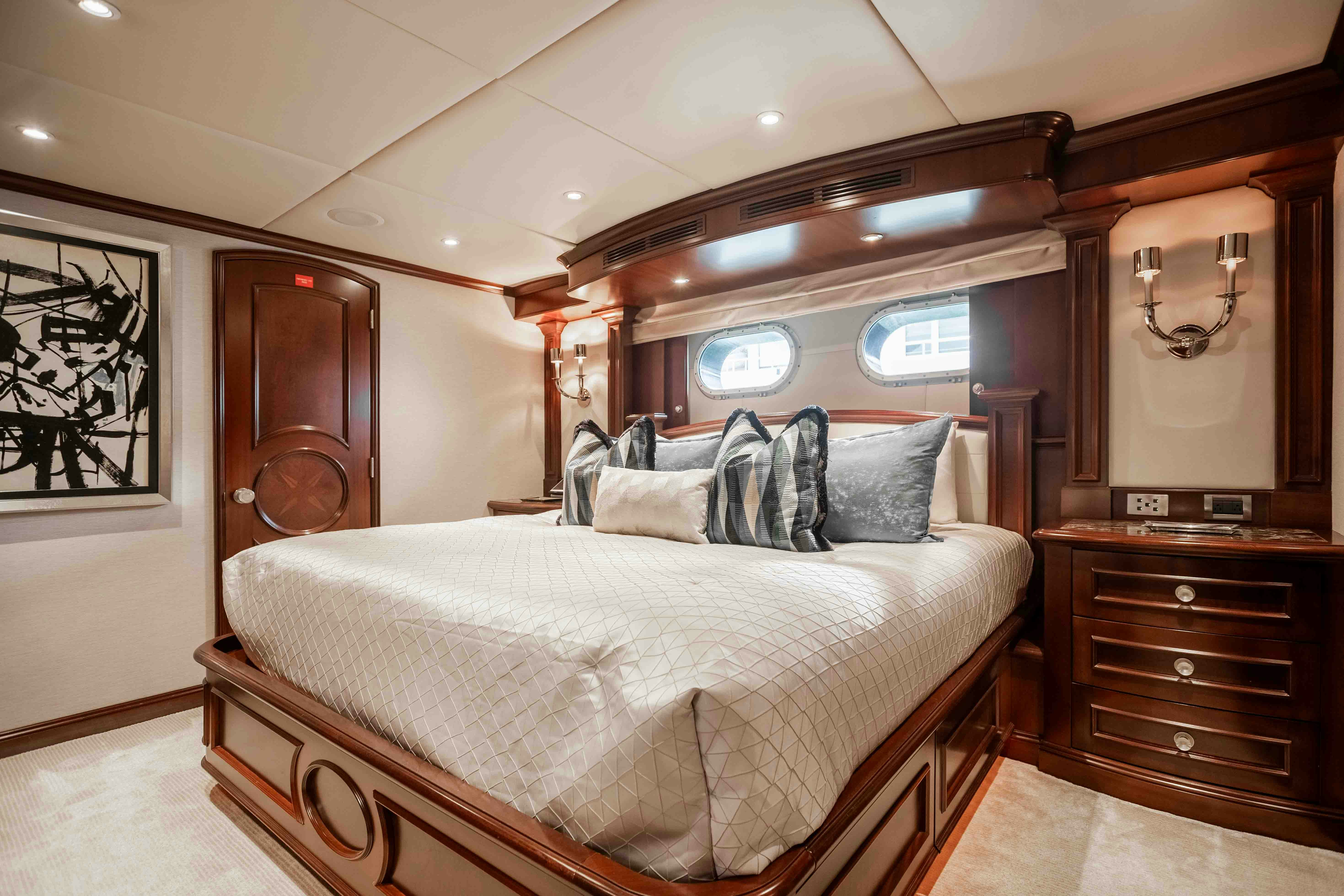 a bedroom with a large bed aboard MIRABELLA Yacht for Sale