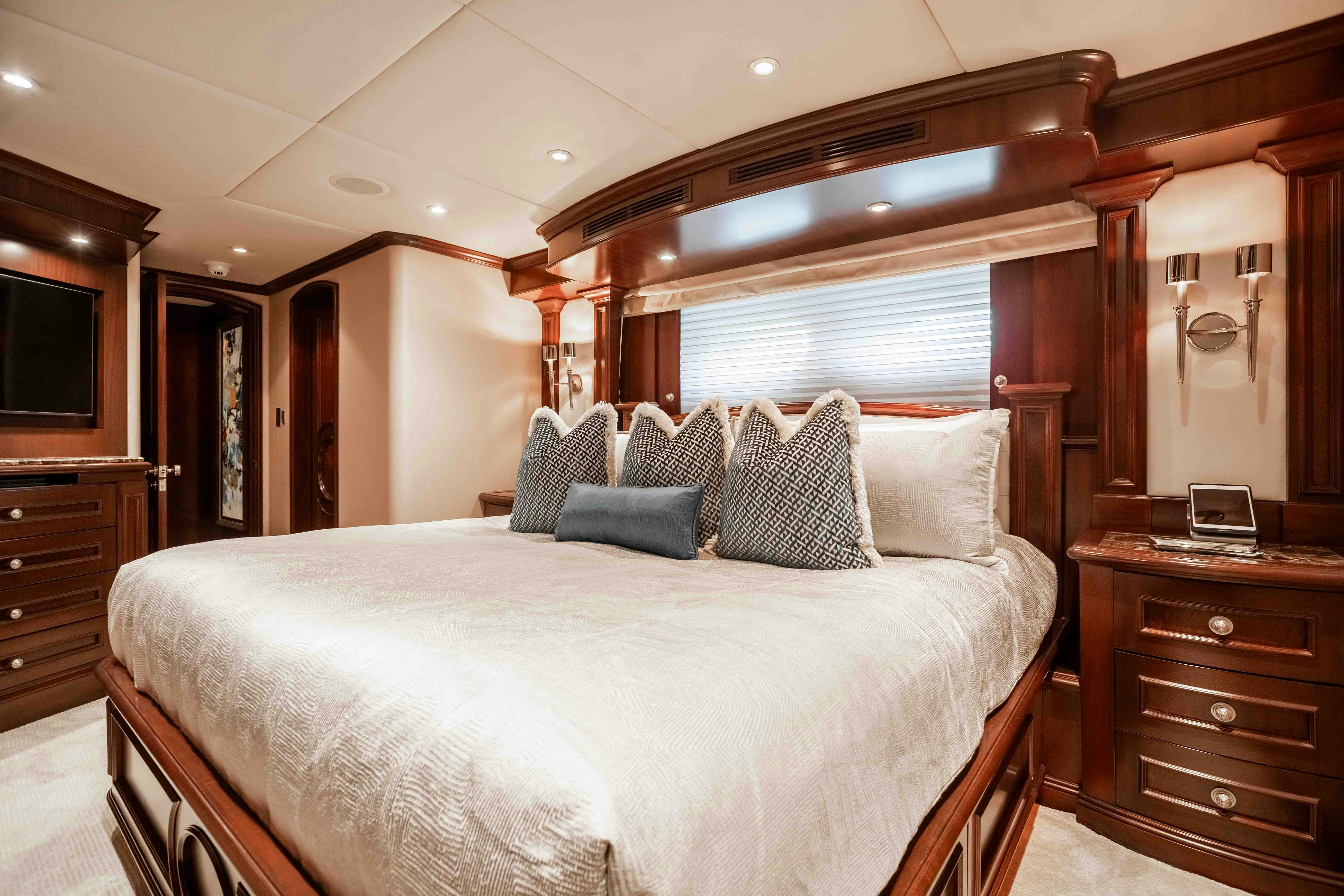 a bedroom with a large bed aboard MIRABELLA Yacht for Sale