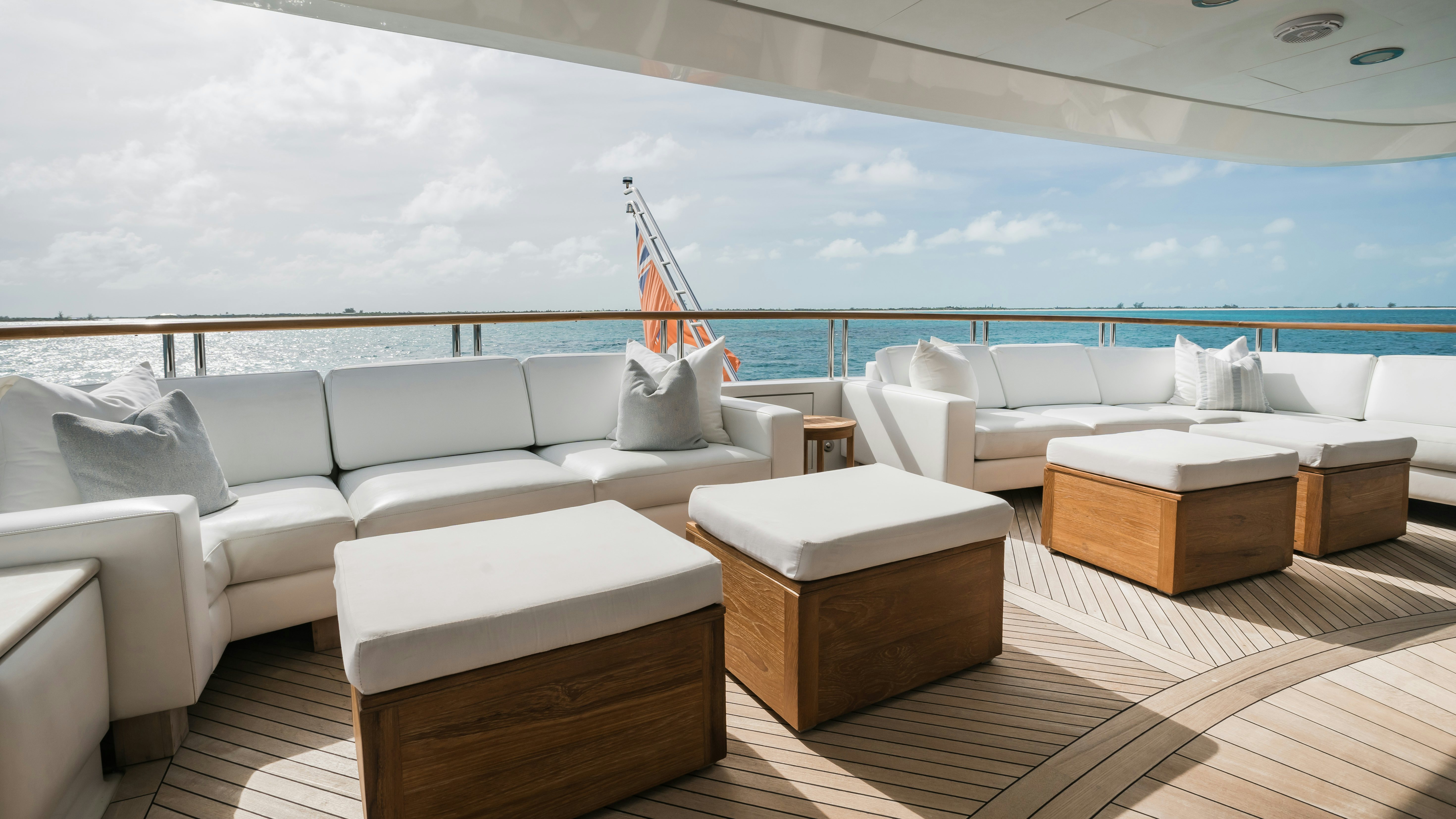 a room with a couch and a table and a large window aboard MIRABELLA Yacht for Sale