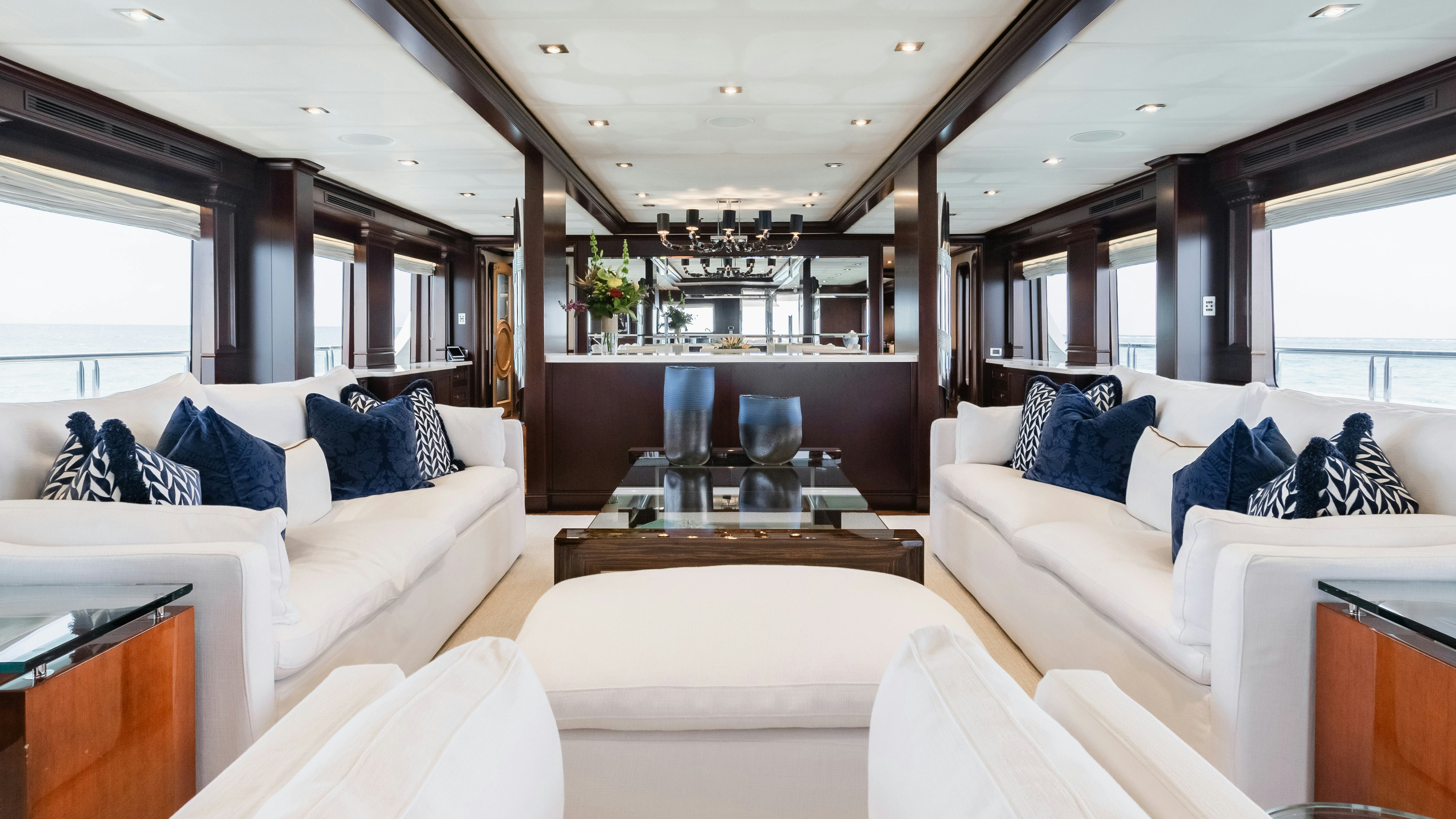 a living room with white couches aboard MIRABELLA Yacht for Sale