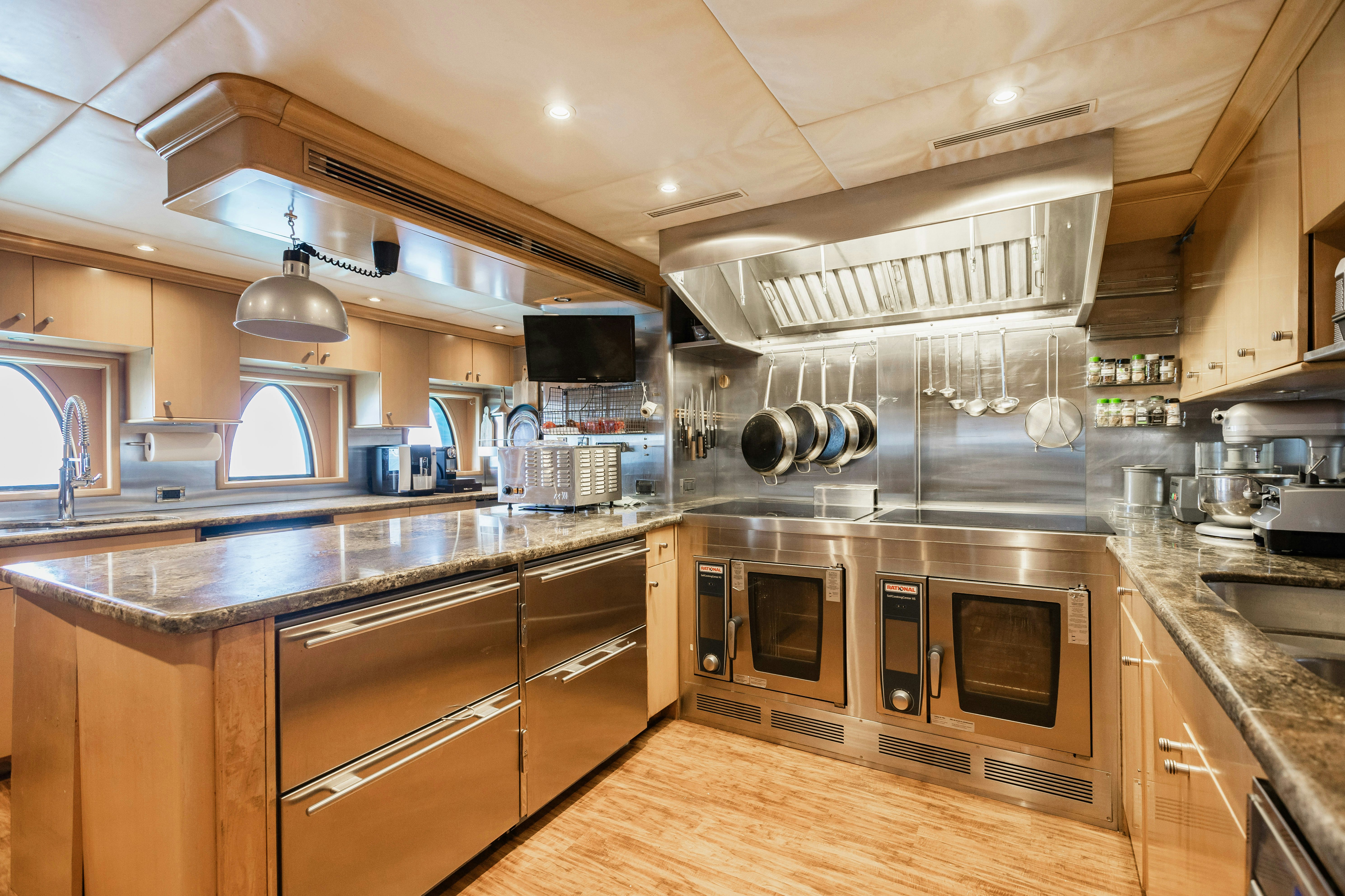 a kitchen with stainless steel appliances aboard MIRABELLA Yacht for Sale