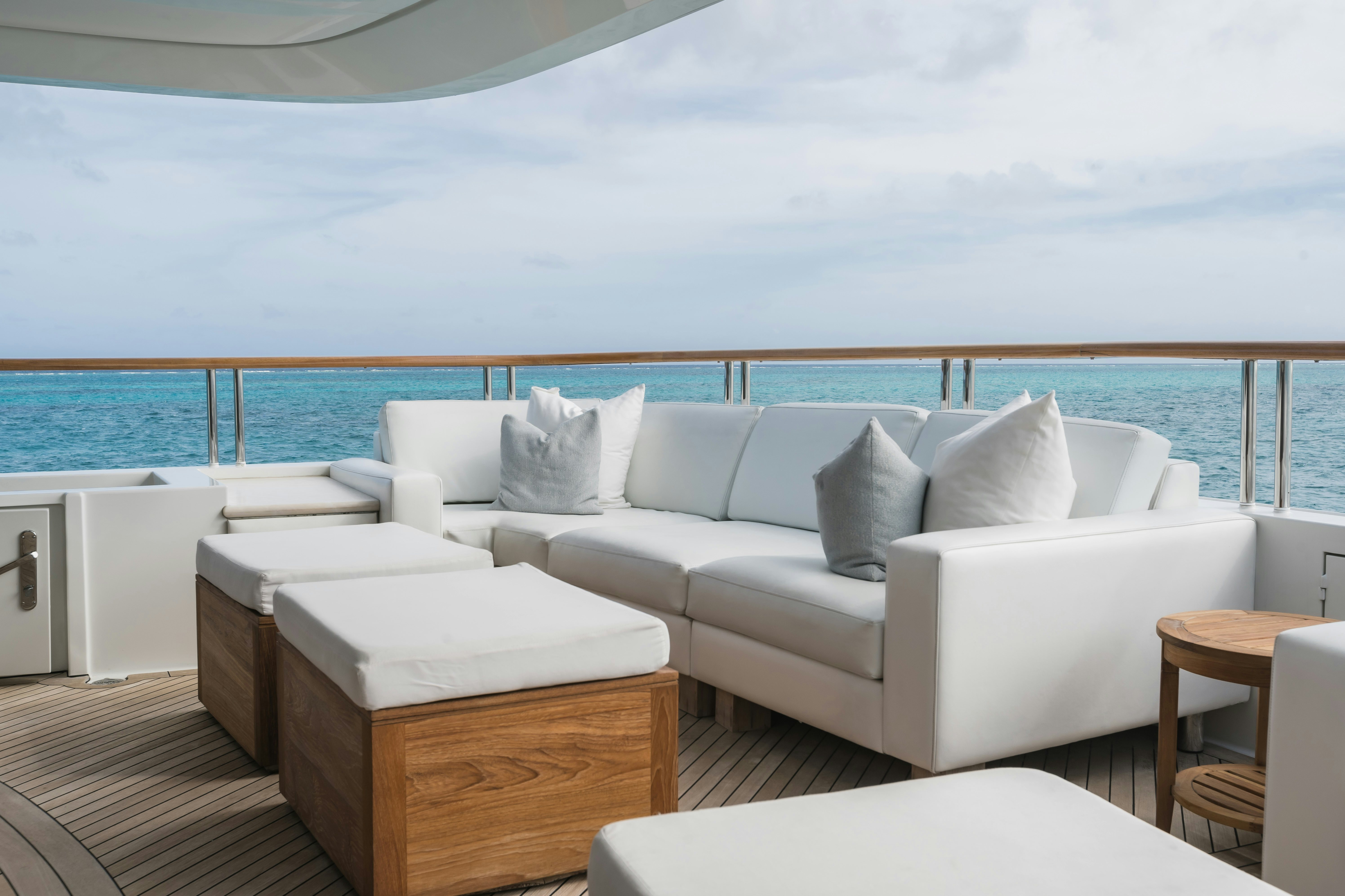 a white couch in a room aboard MIRABELLA Yacht for Sale