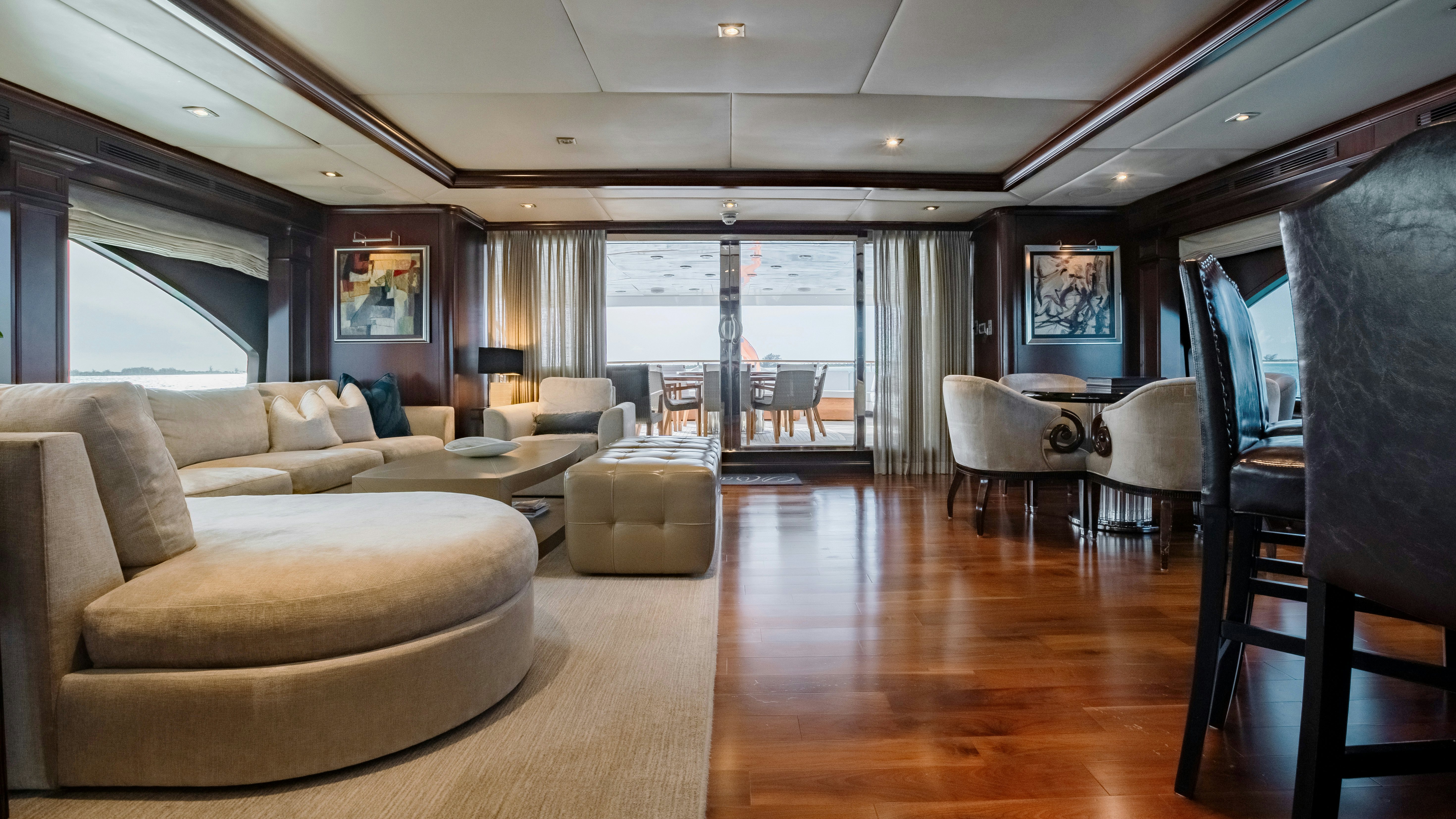 a living room with a wood floor aboard MIRABELLA Yacht for Sale