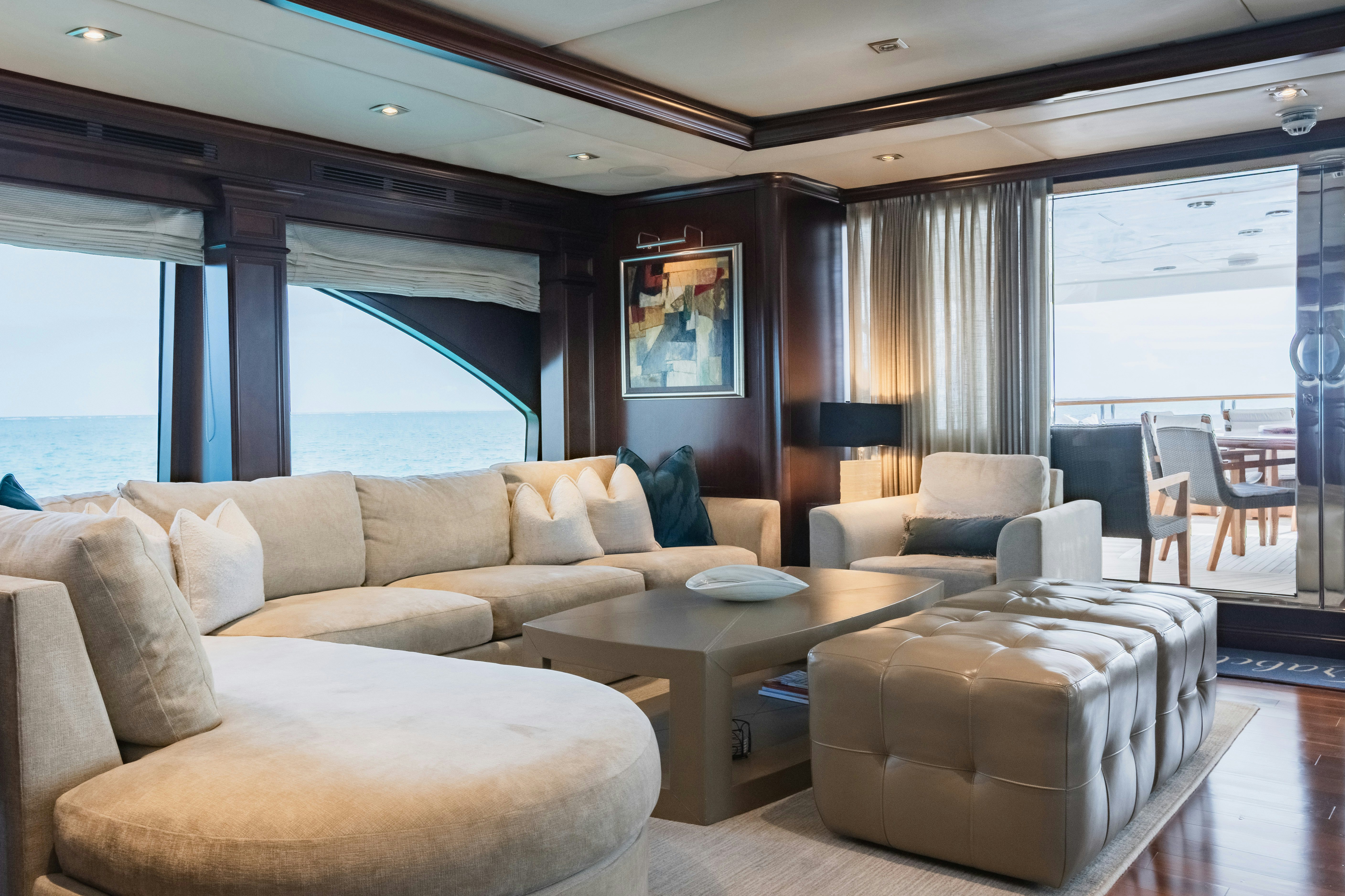 a living room with a couch and a table aboard MIRABELLA Yacht for Sale