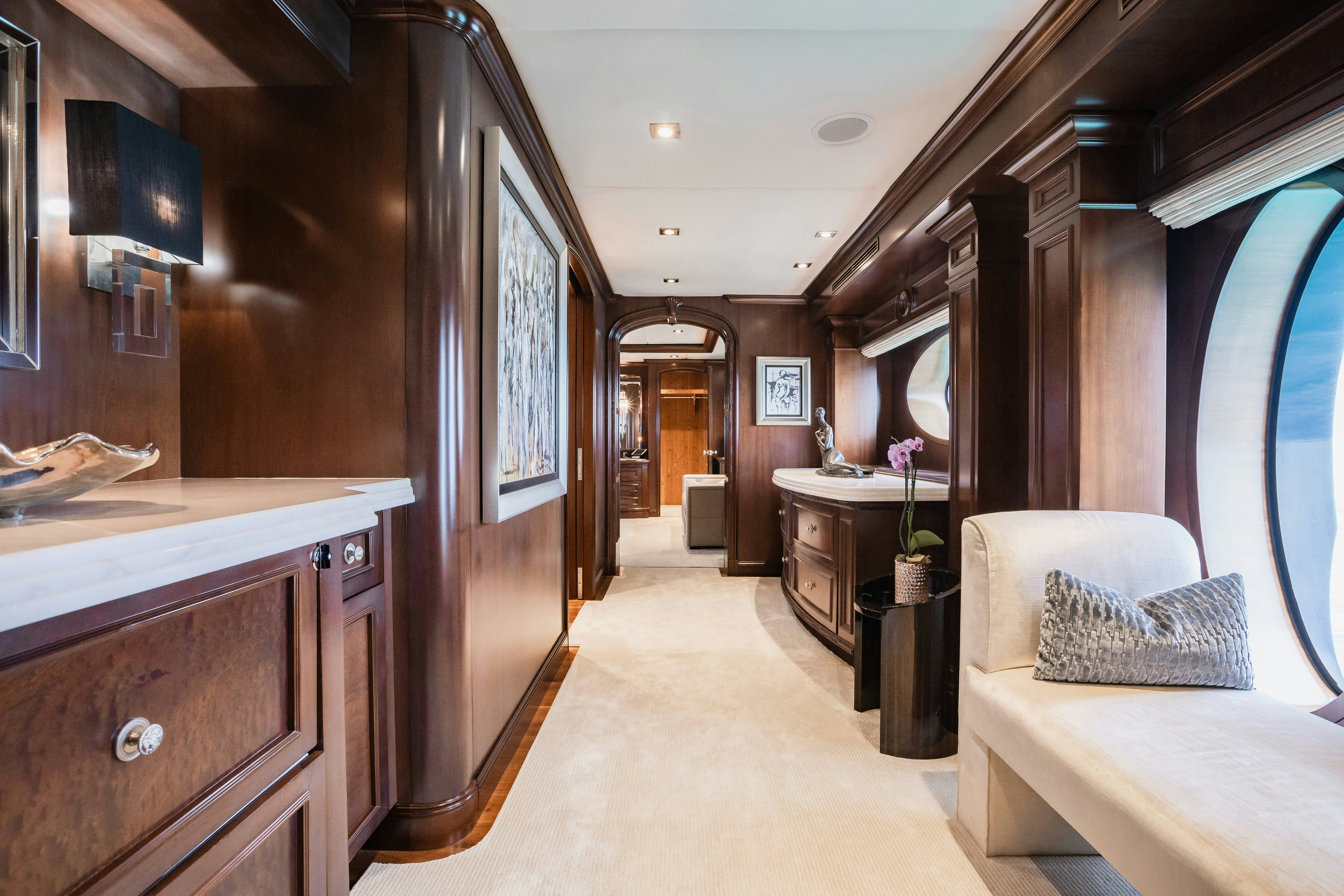 a room with a couch and a table aboard MIRABELLA Yacht for Sale