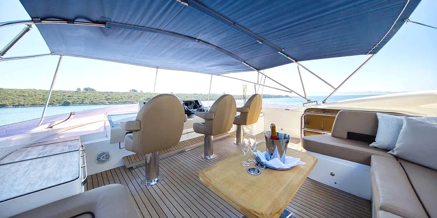 a boat with a table and chairs aboard AGAVE Yacht for Sale