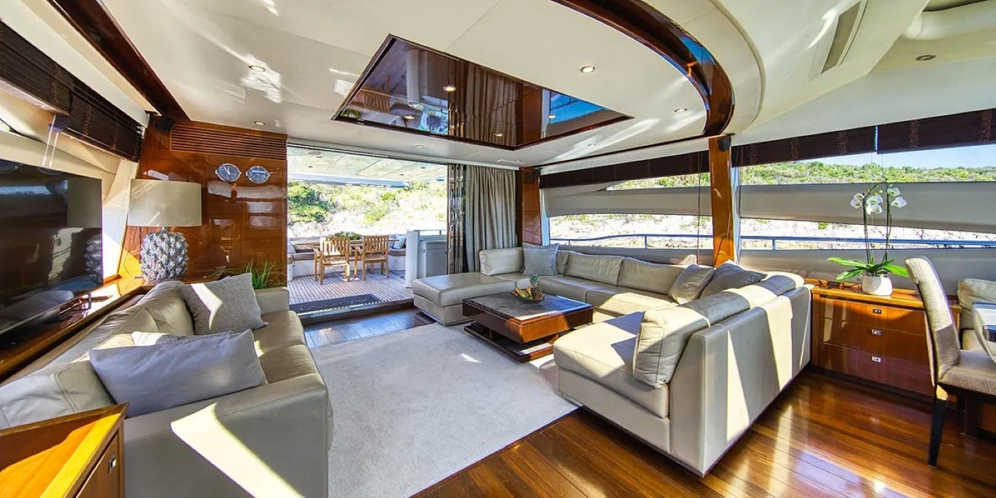 a large living room with a large window aboard AGAVE Yacht for Sale