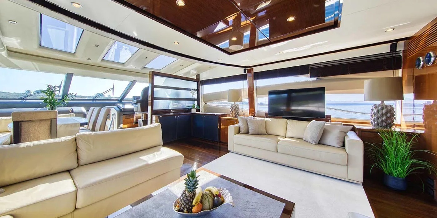 a living room with a large open ceiling aboard AGAVE Yacht for Sale