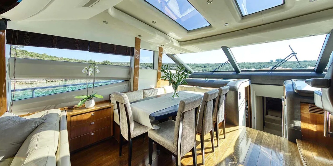 a room with a table and chairs aboard AGAVE Yacht for Sale