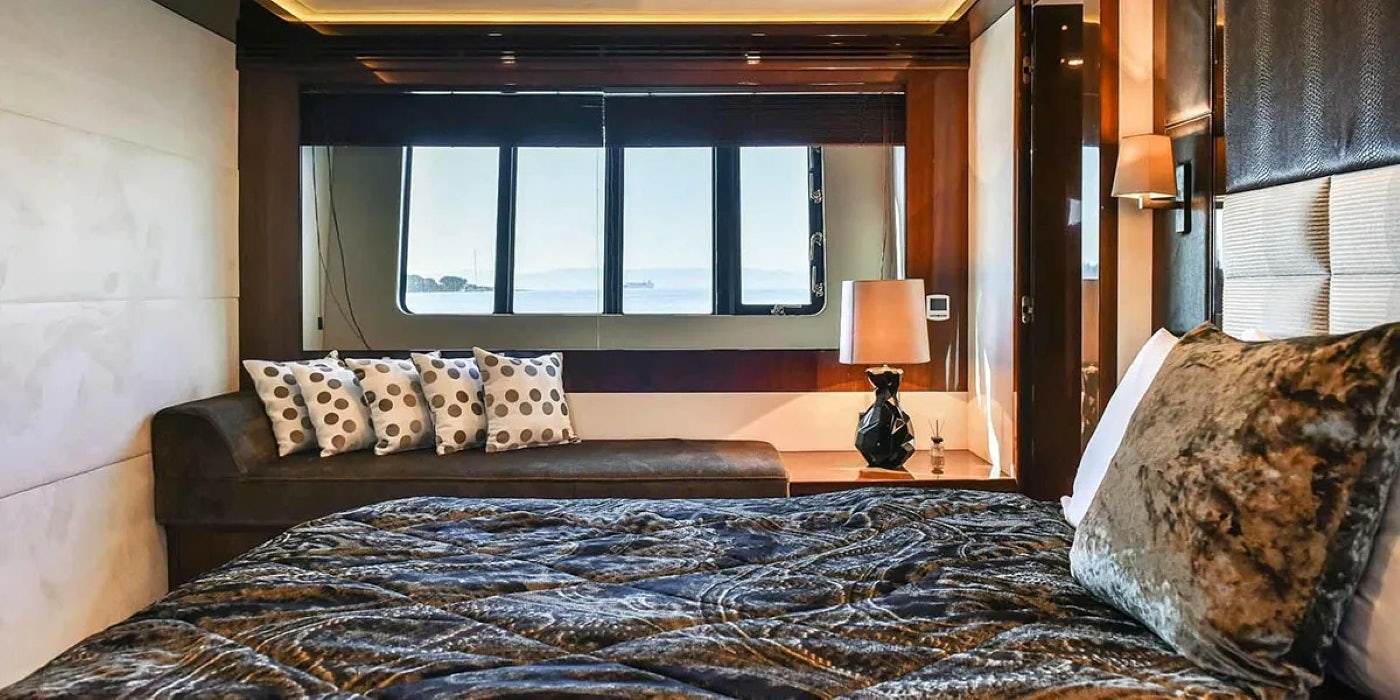 a bed with pillows and pillows aboard AGAVE Yacht for Sale