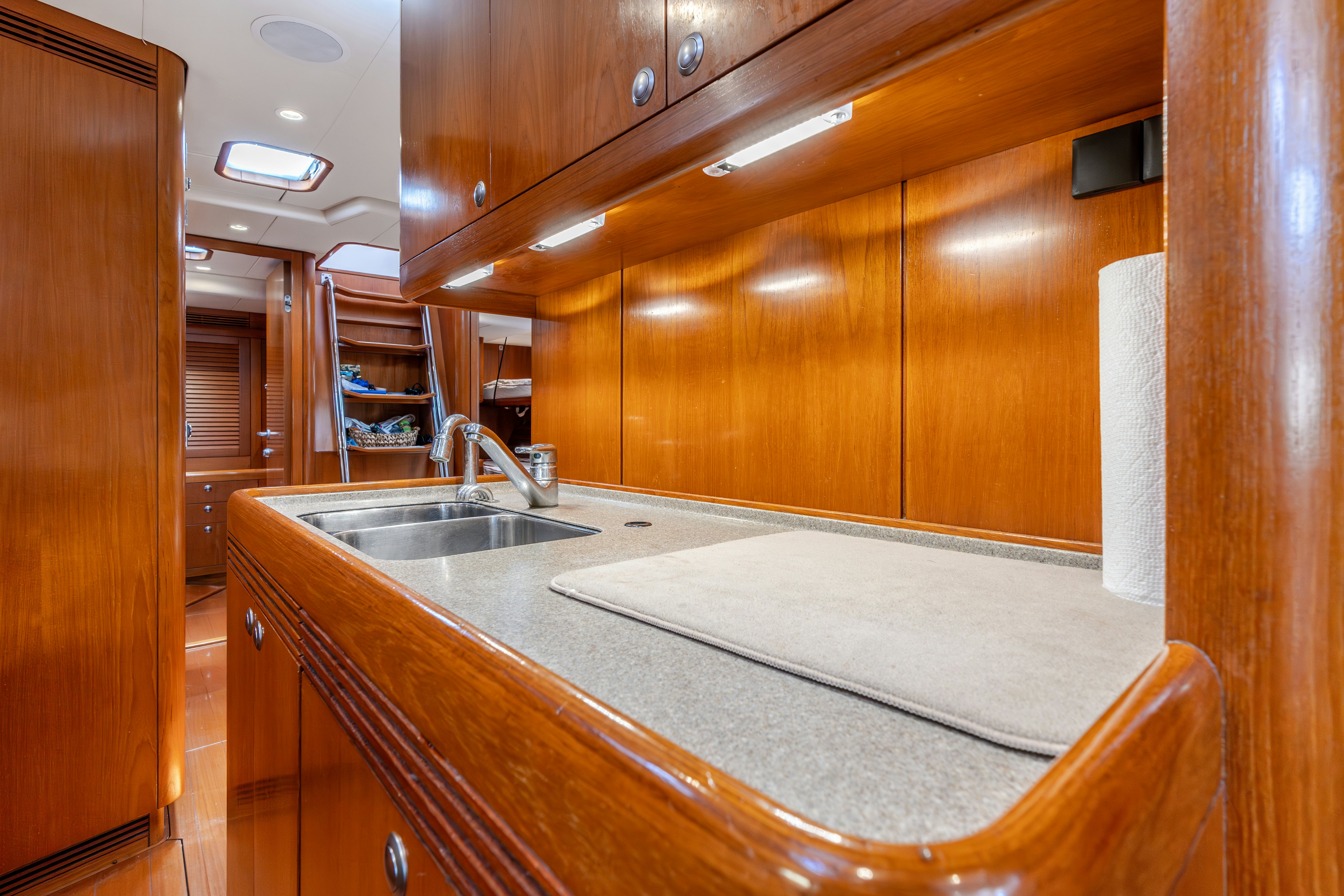 a kitchen with a large island aboard WHITE RHINO Yacht for Sale