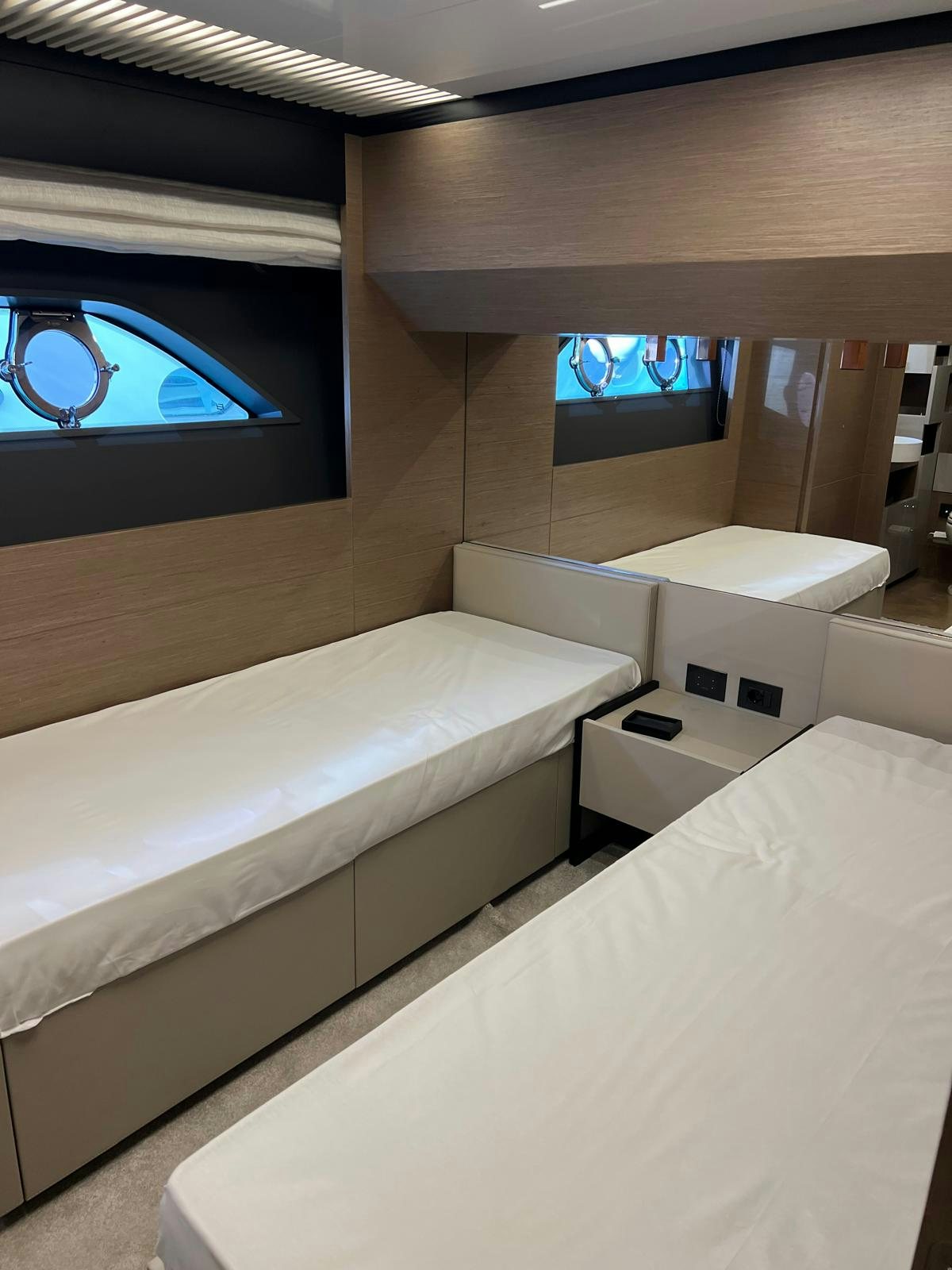 a room with a bed and a window aboard PICCOLINO Yacht for Sale