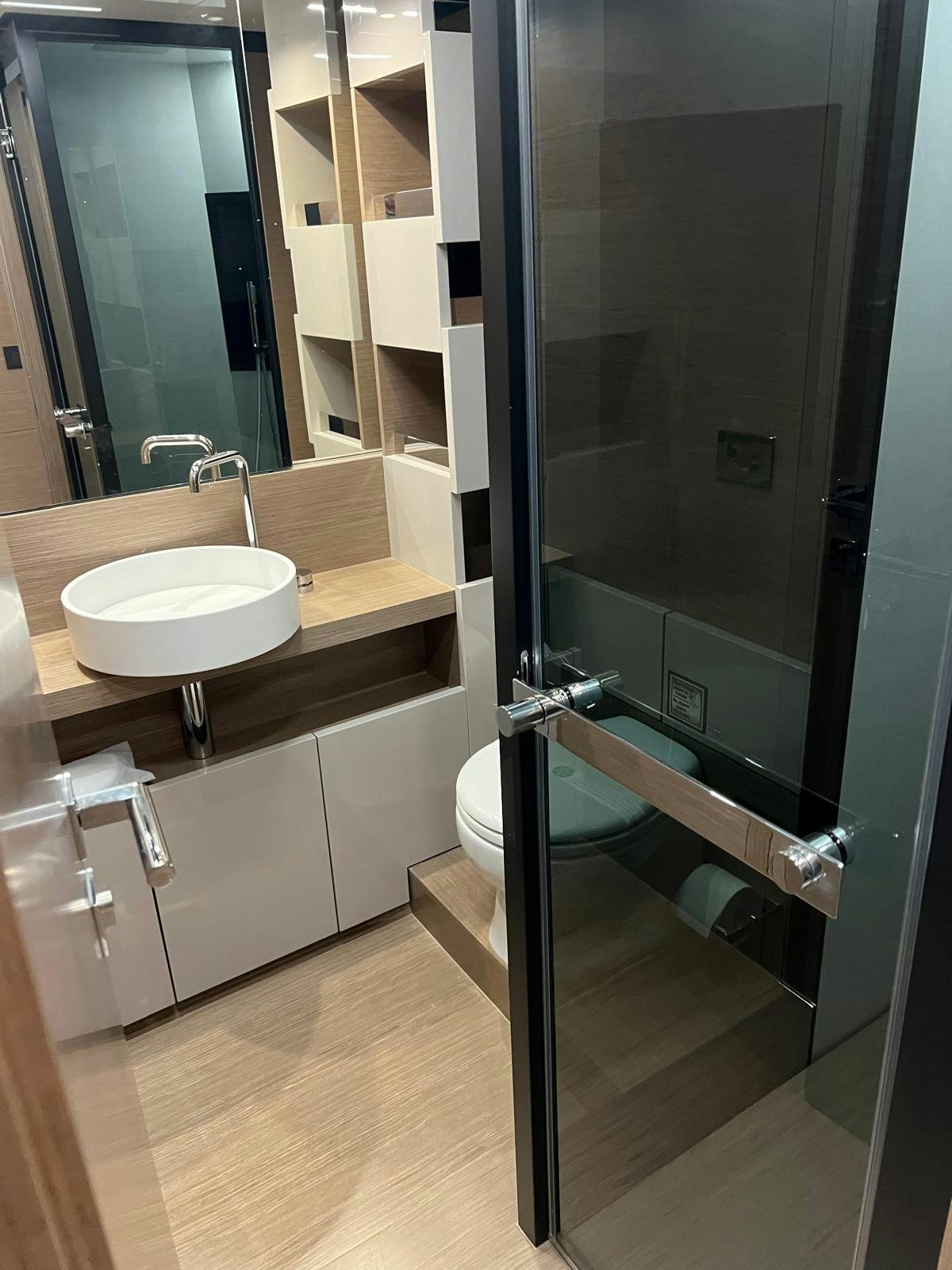 a bathroom with a sink and a toilet aboard PICCOLINO Yacht for Sale