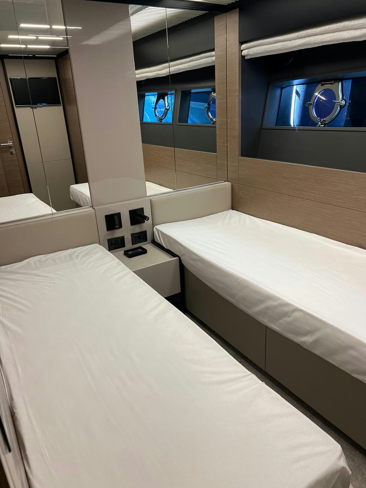 a room with a large white bed aboard PICCOLINO Yacht for Sale