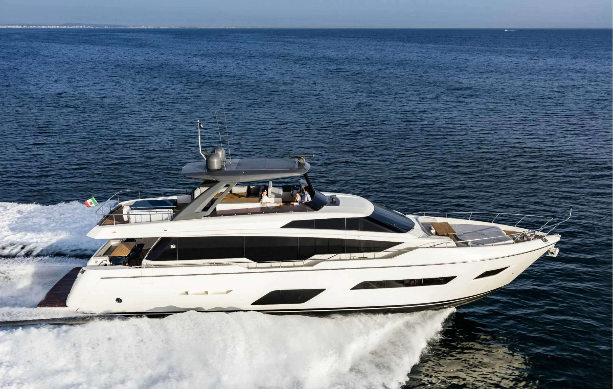 a white yacht on the water aboard PICCOLINO Yacht for Sale