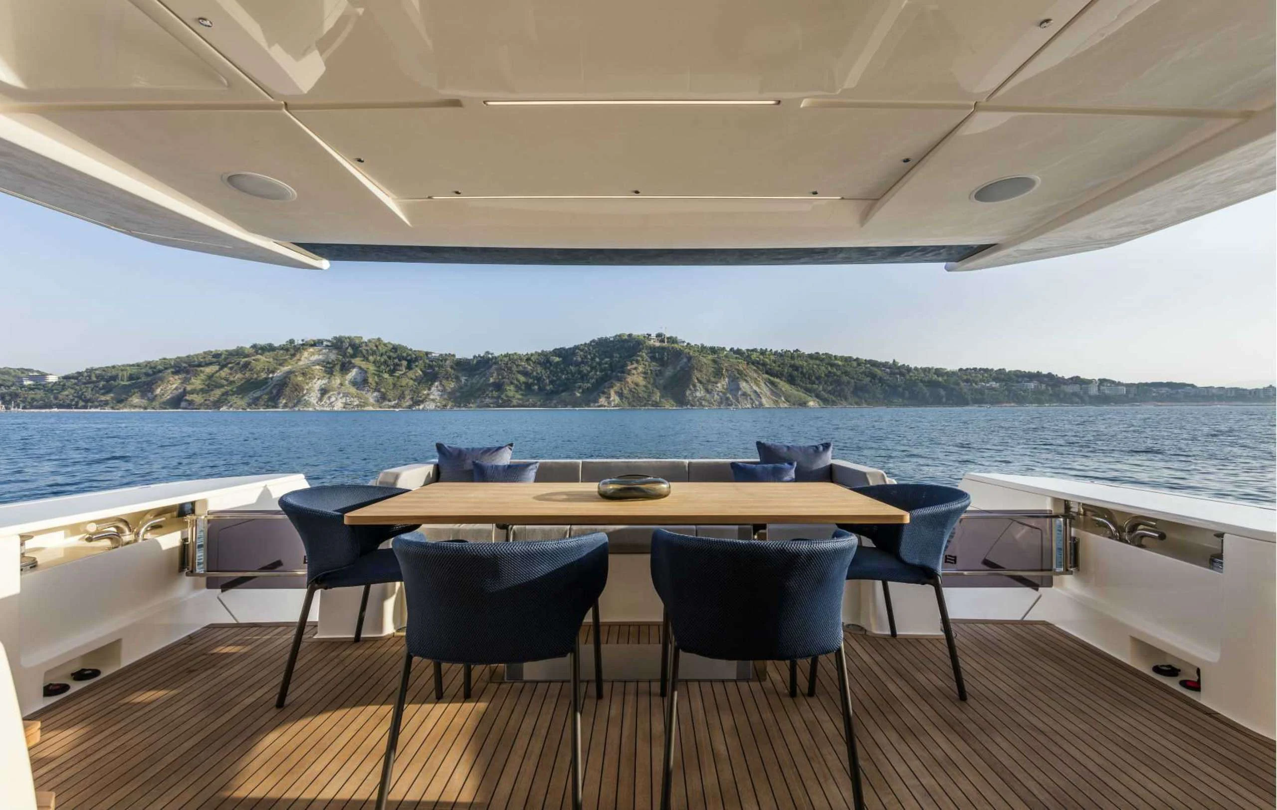 a table and chairs on a boat aboard PICCOLINO Yacht for Sale