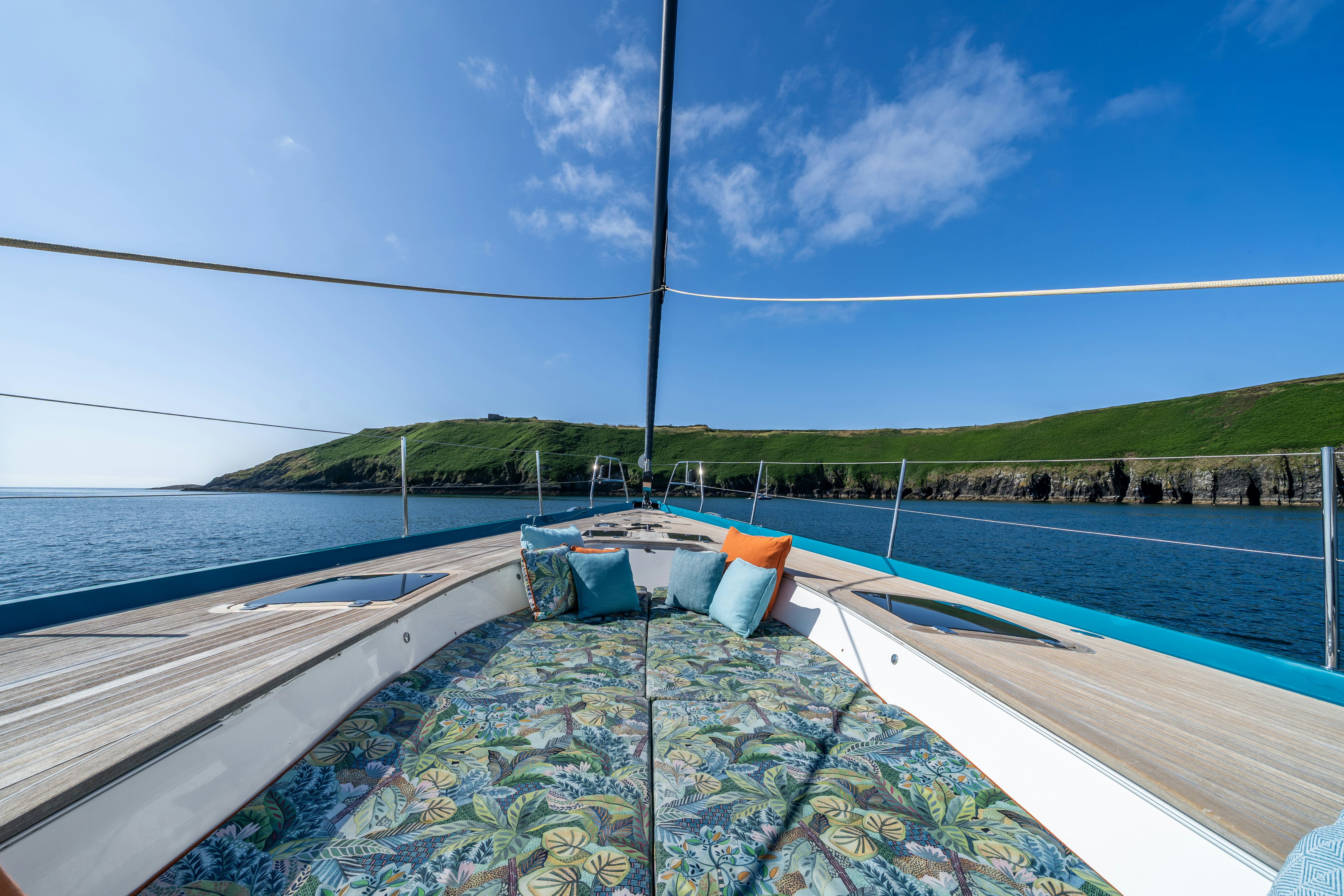 a swimming pool with a view of a city and a hill in the distance aboard KARIBU Yacht for Sale