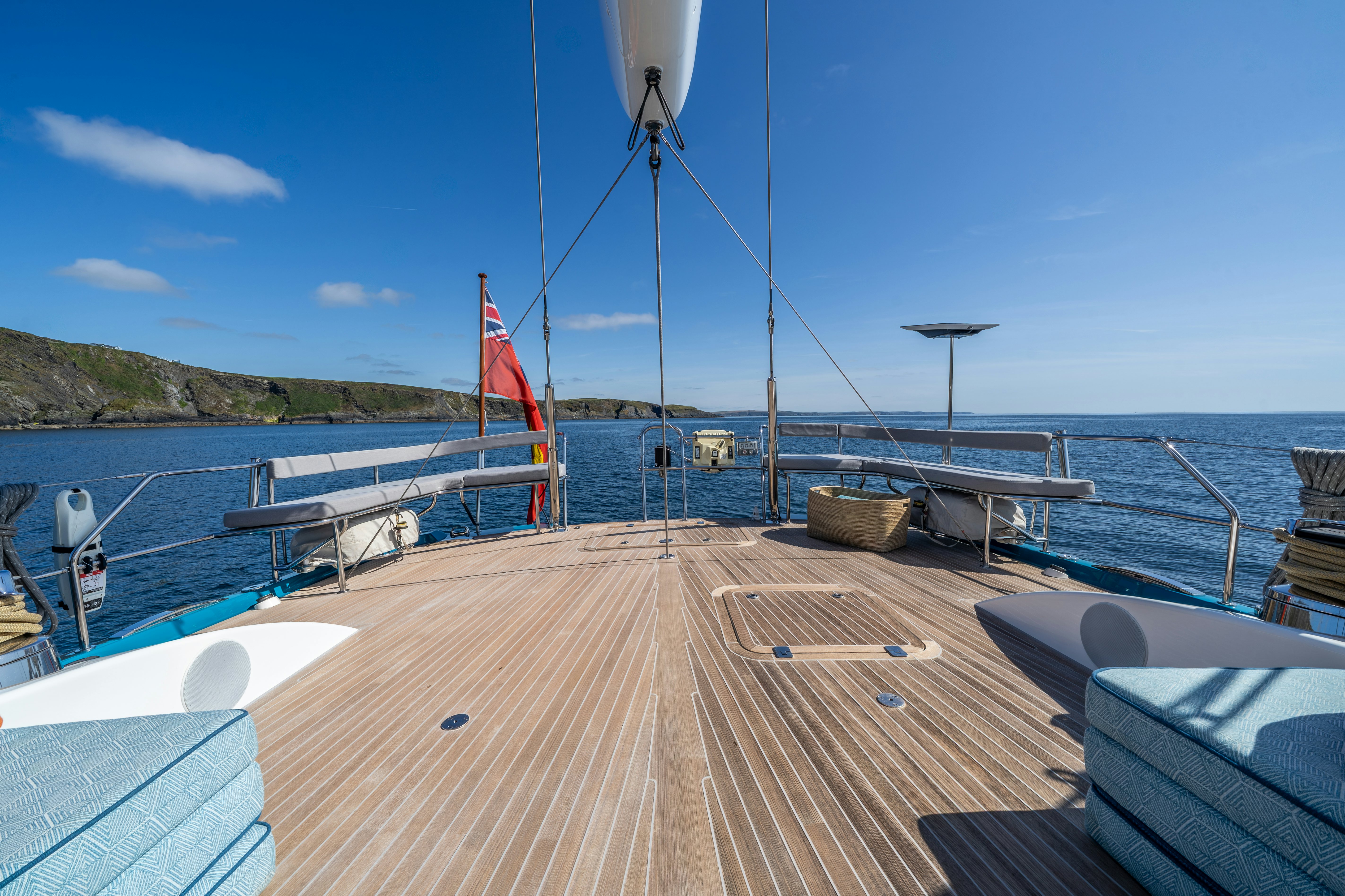 a wooden dock with a flag on it aboard KARIBU Yacht for Sale