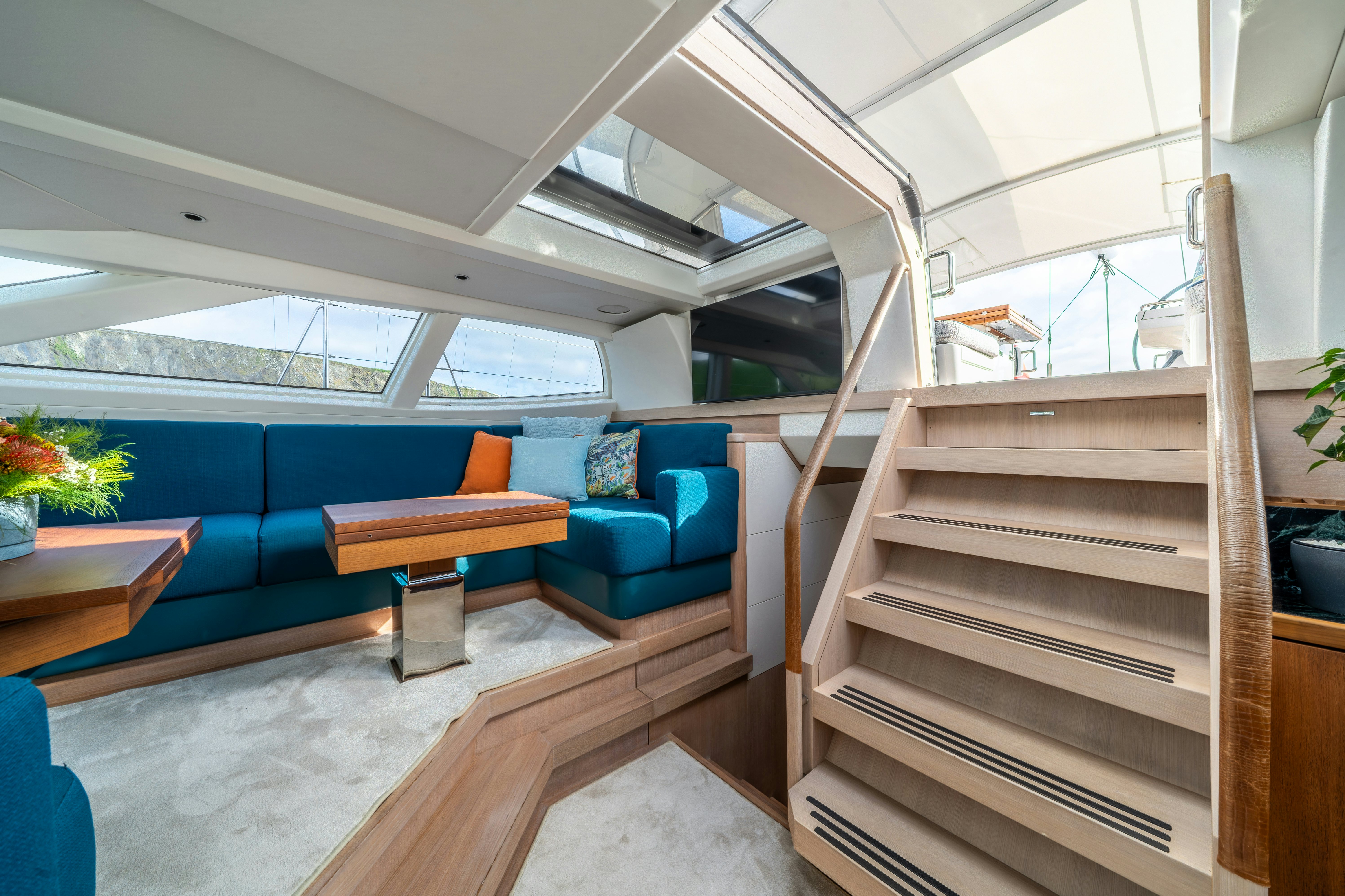 a room with a couch and a table aboard KARIBU Yacht for Sale