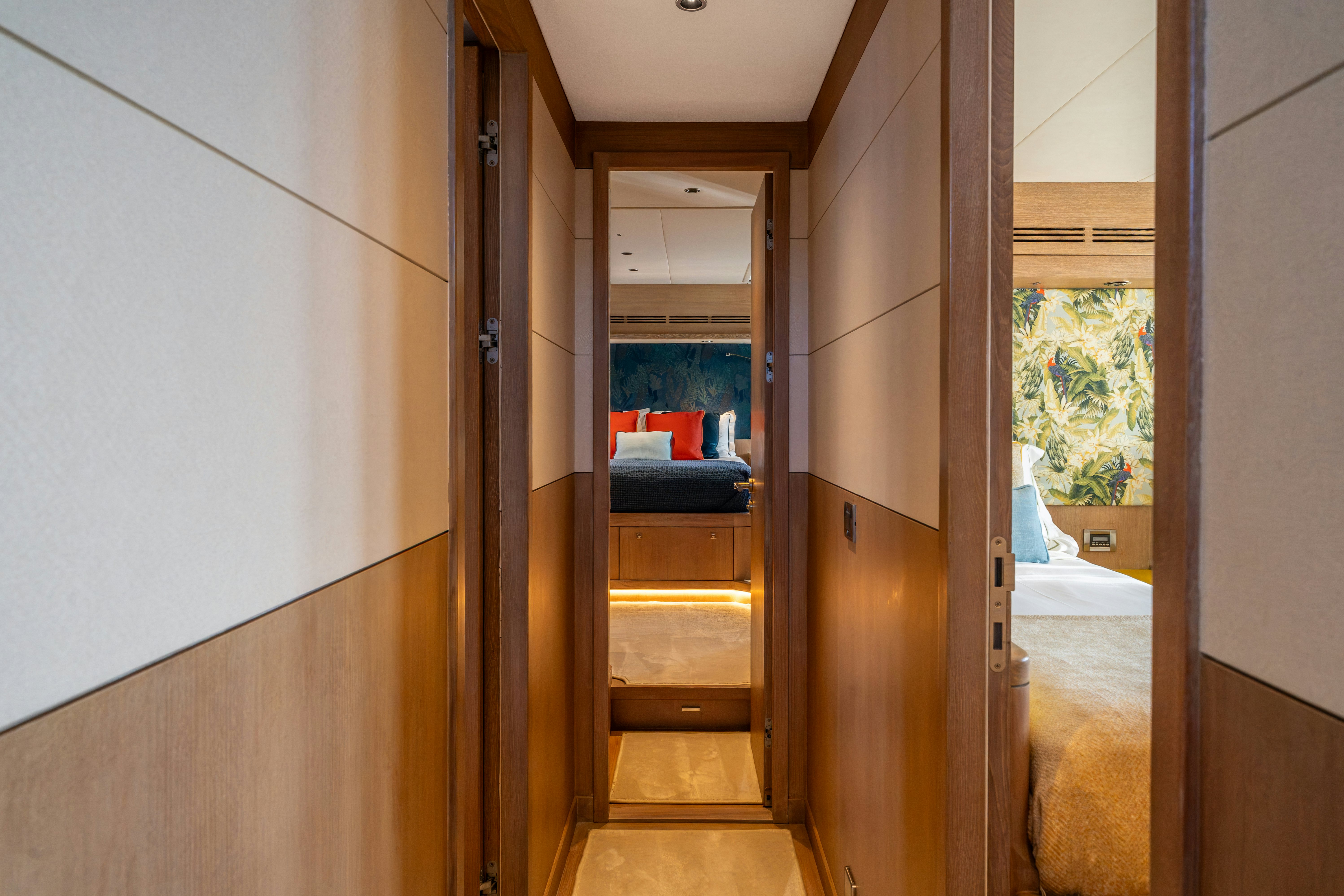 a room with a bed and a door aboard KARIBU Yacht for Sale