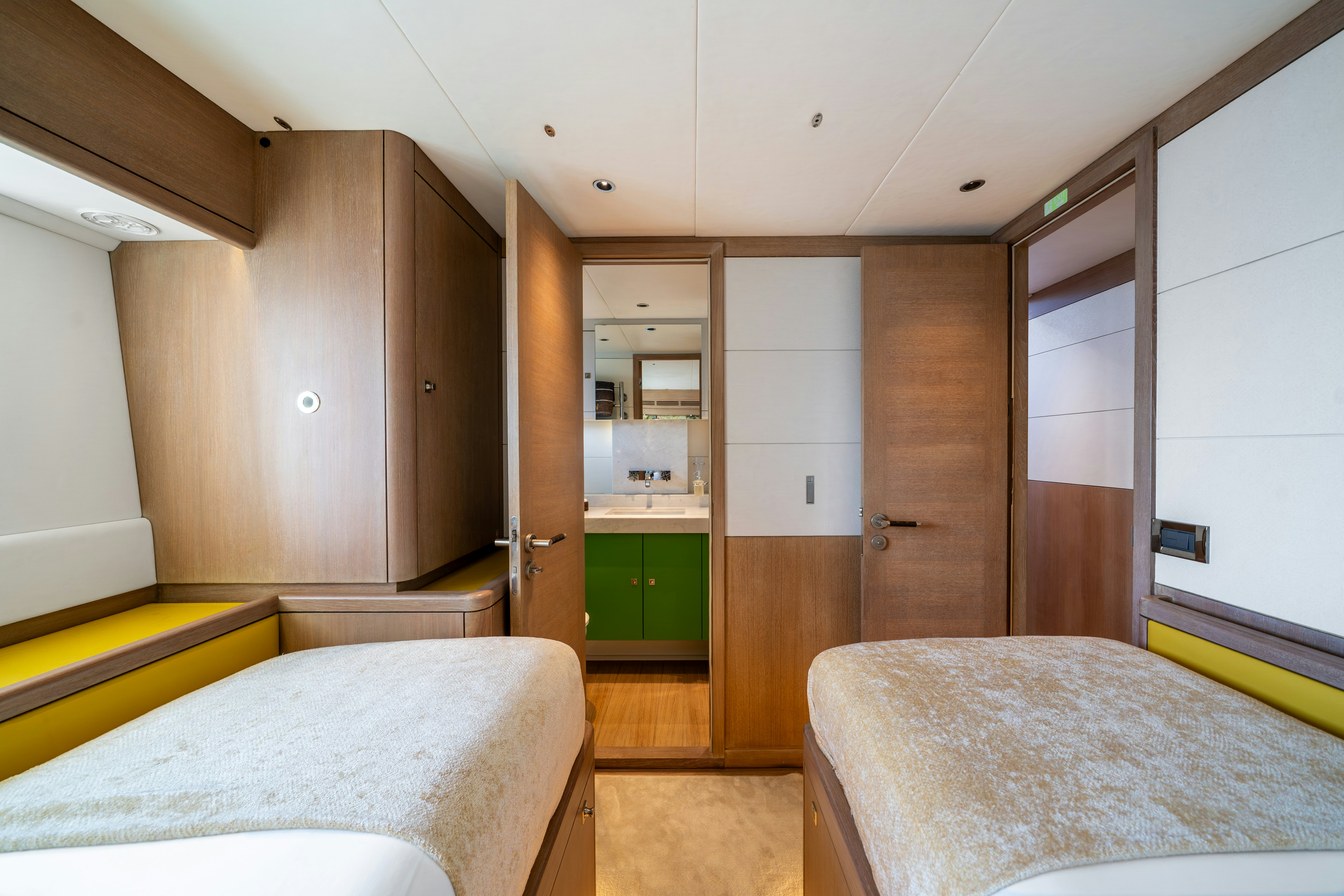 a bedroom with a bed and a closet aboard KARIBU Yacht for Sale