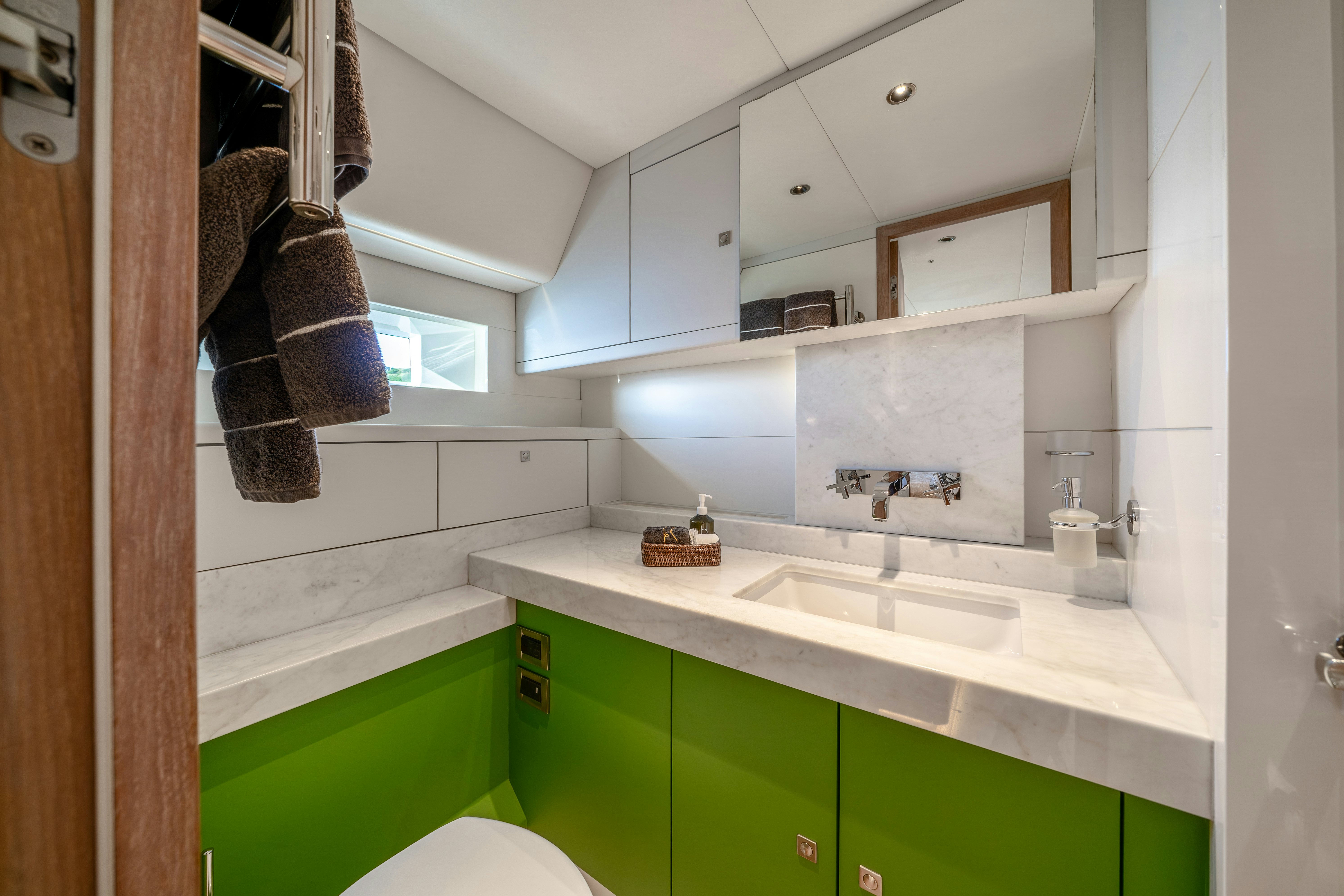a bathroom with a sink and a mirror aboard KARIBU Yacht for Sale