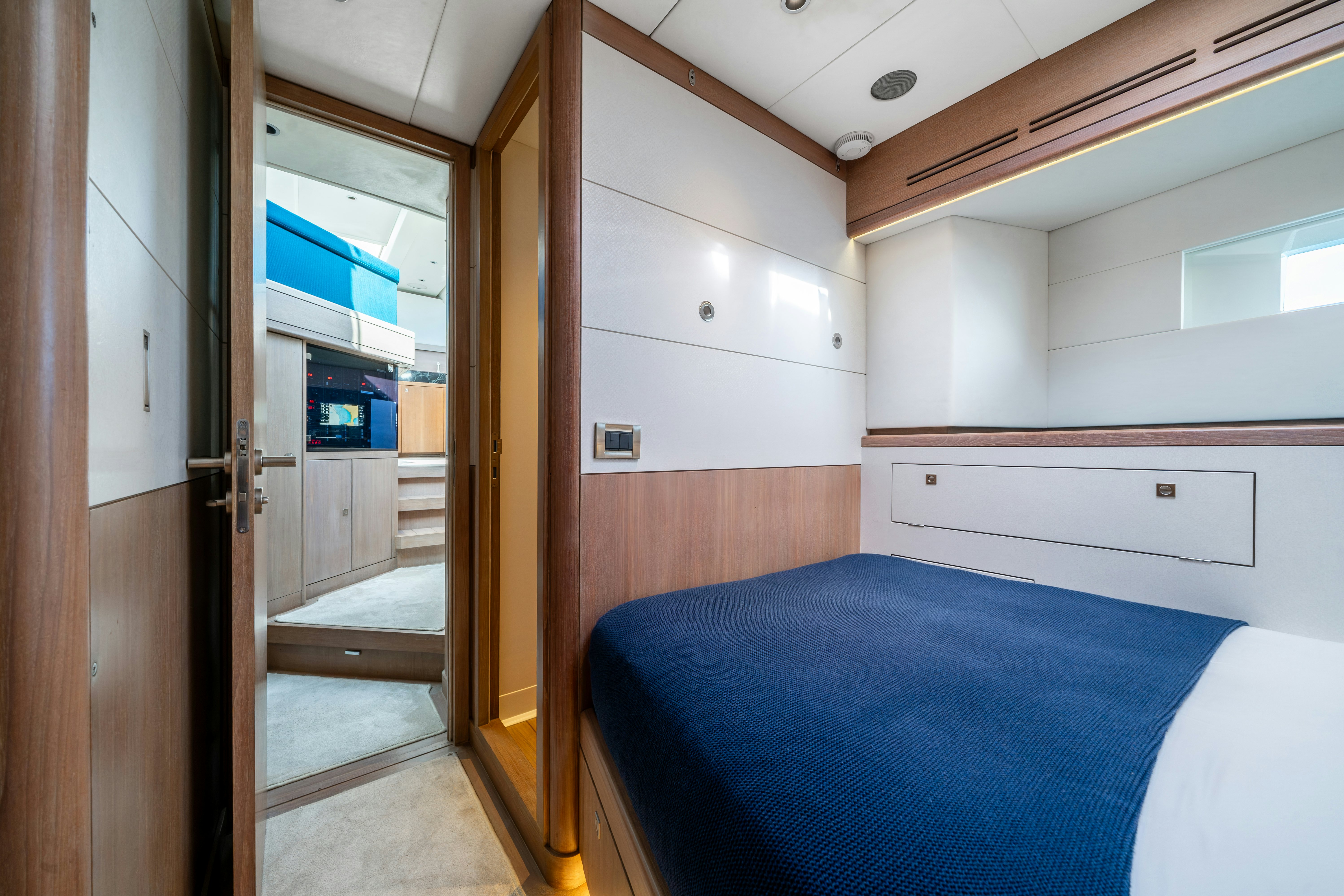 a room with a bed and a door aboard KARIBU Yacht for Sale