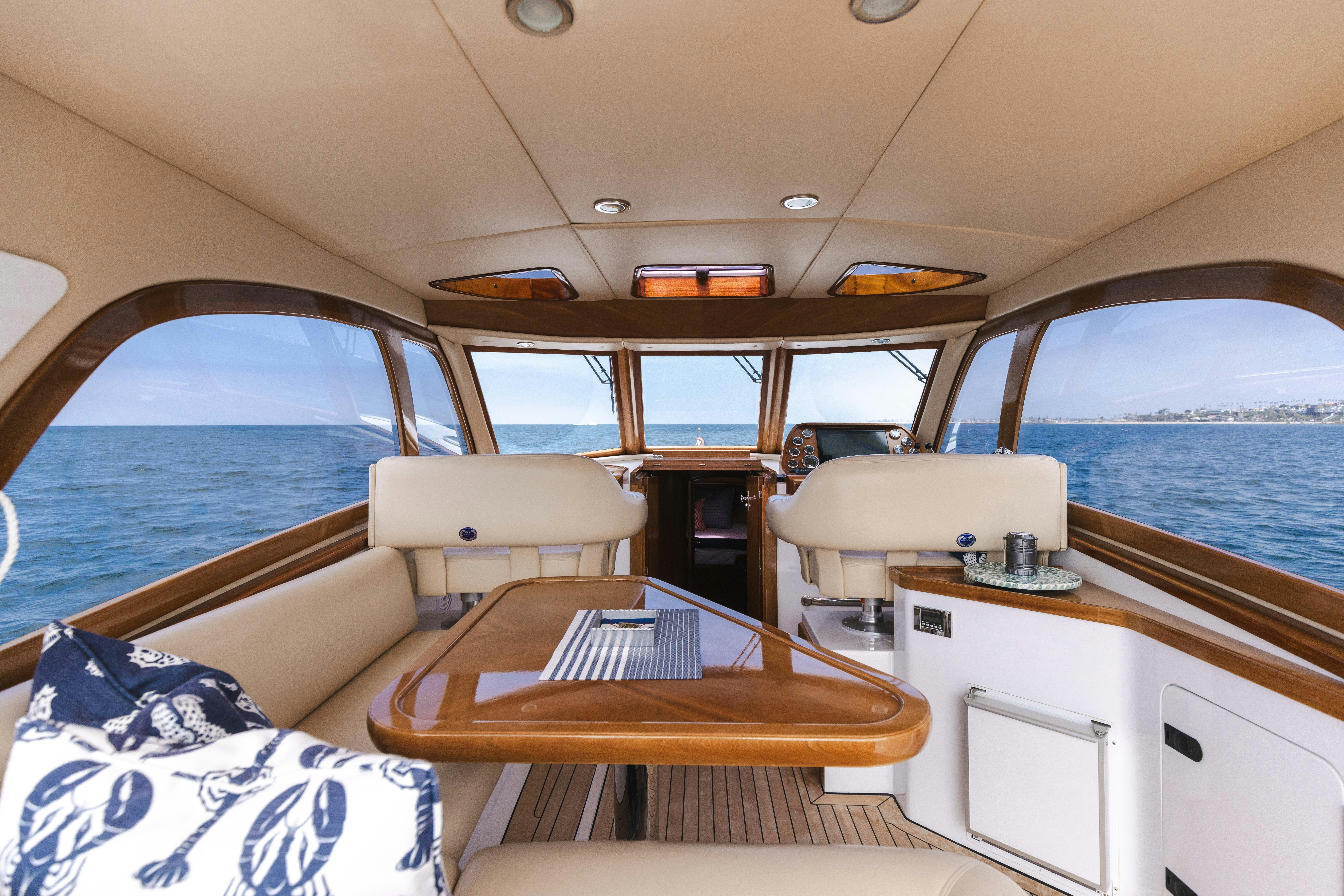 a boat with a table and chairs aboard TRANQUILITY Yacht for Sale