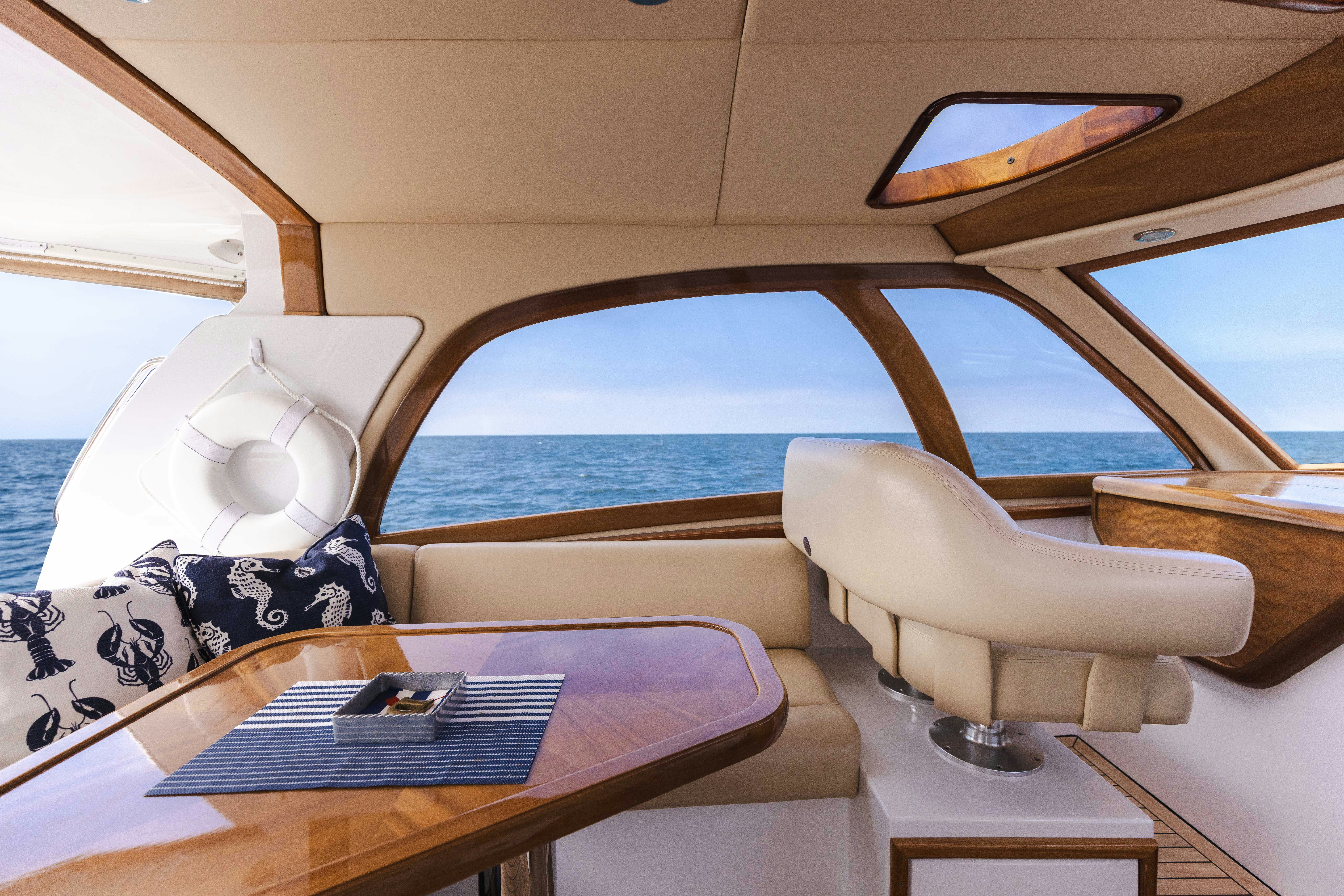 a boat with a table and chairs aboard TRANQUILITY Yacht for Sale