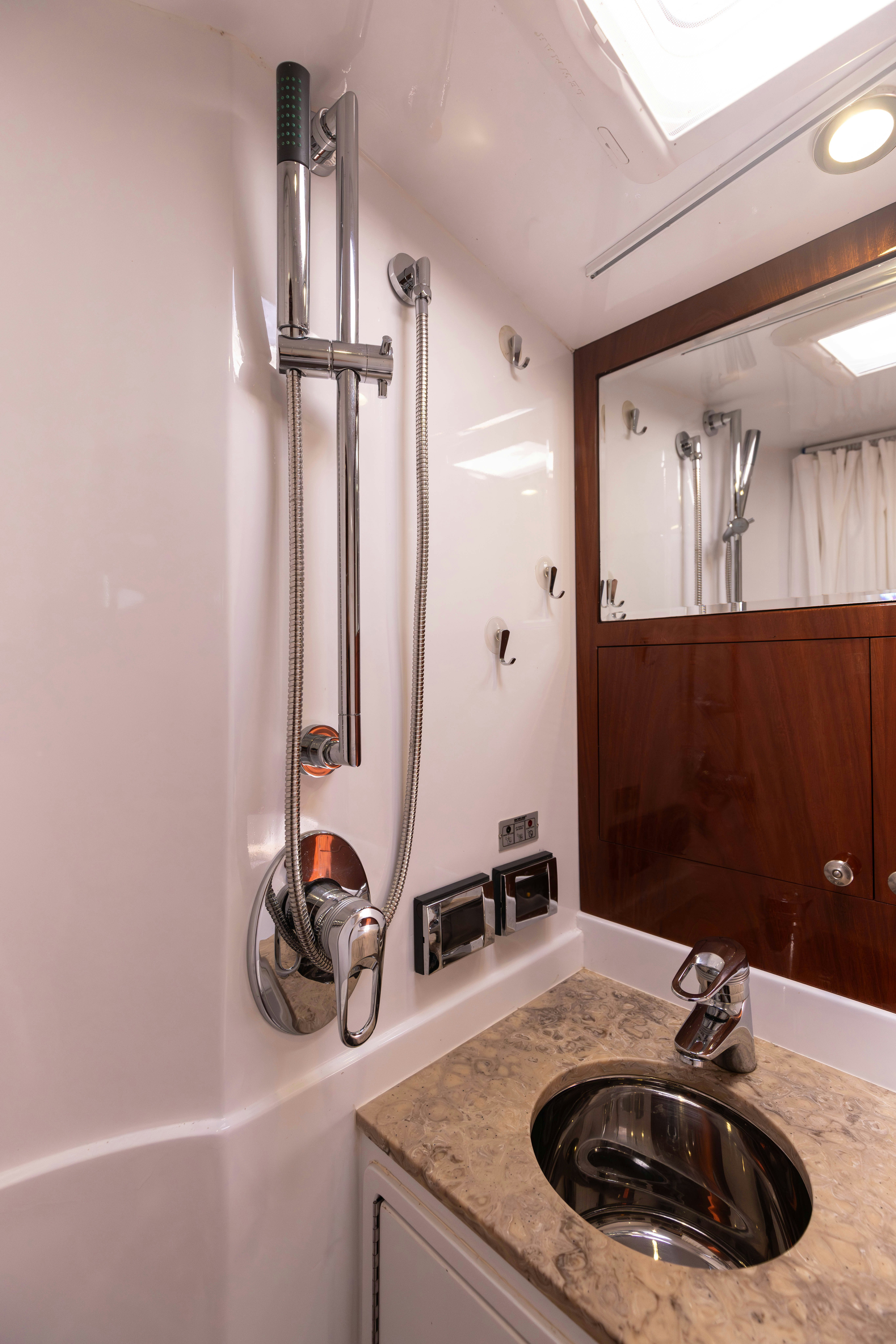 a bathroom with a sink and a mirror aboard TRANQUILITY Yacht for Sale