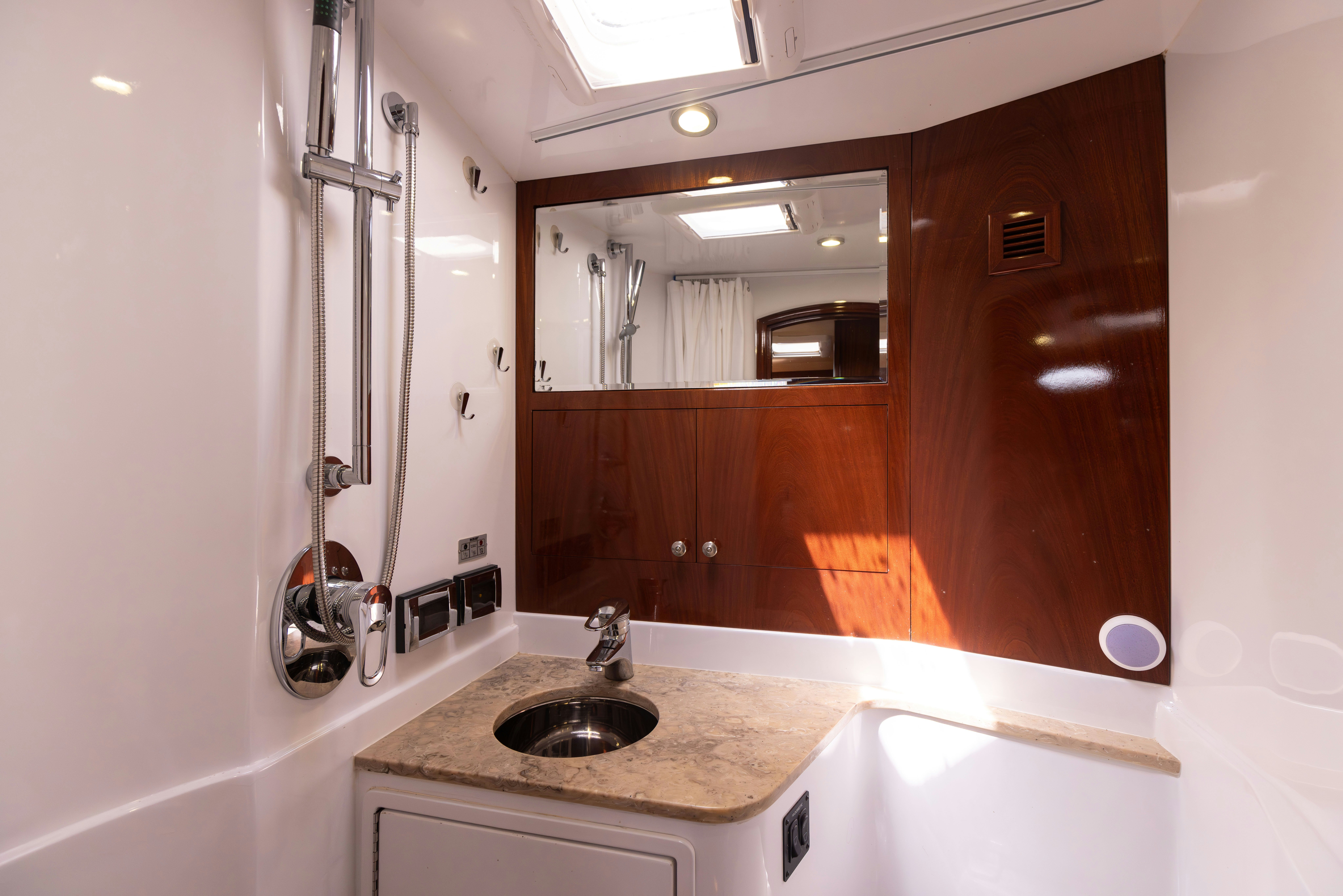 a bathroom with a sink and a mirror aboard TRANQUILITY Yacht for Sale