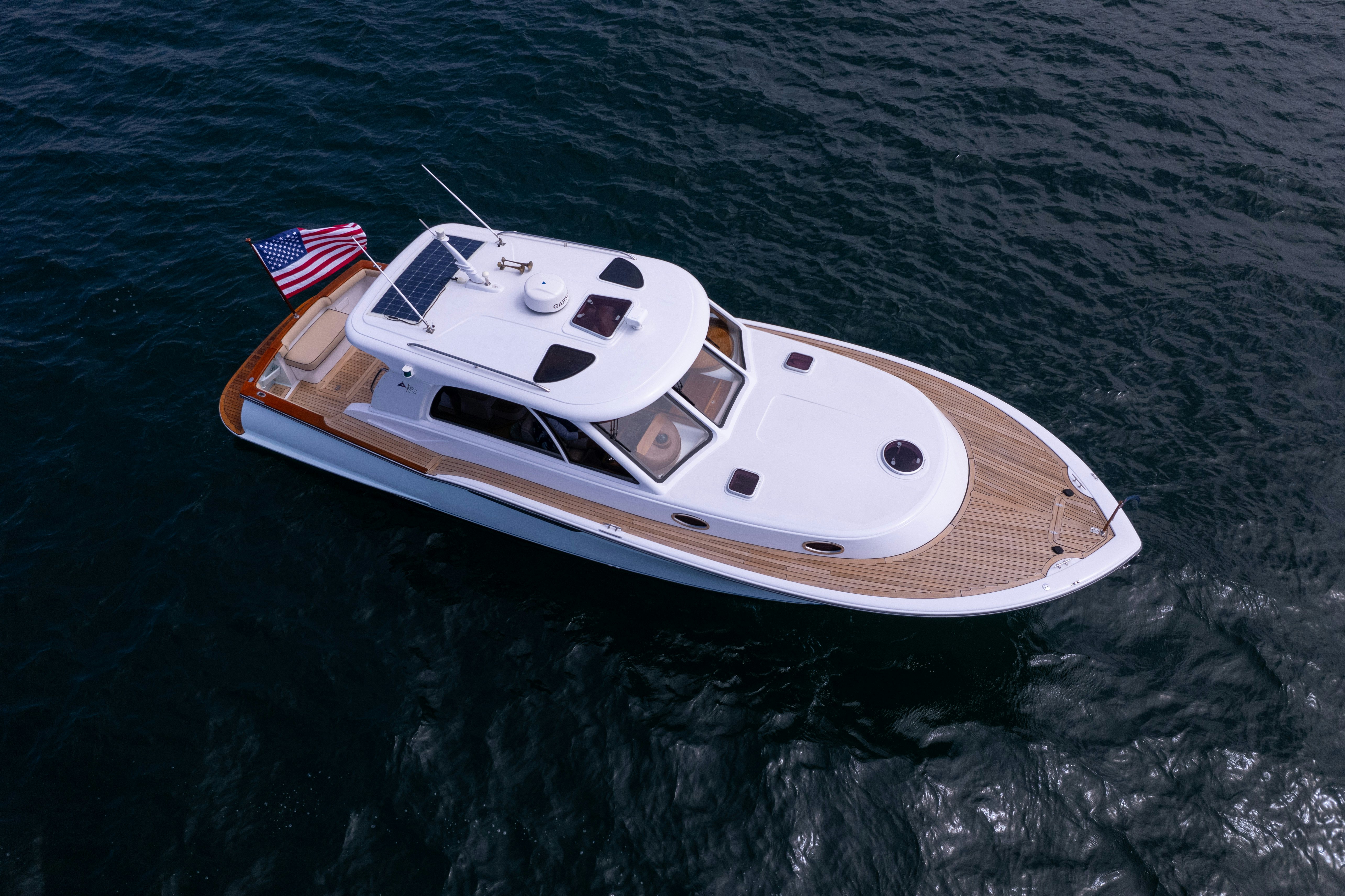 a white and black boat on water aboard TRANQUILITY Yacht for Sale