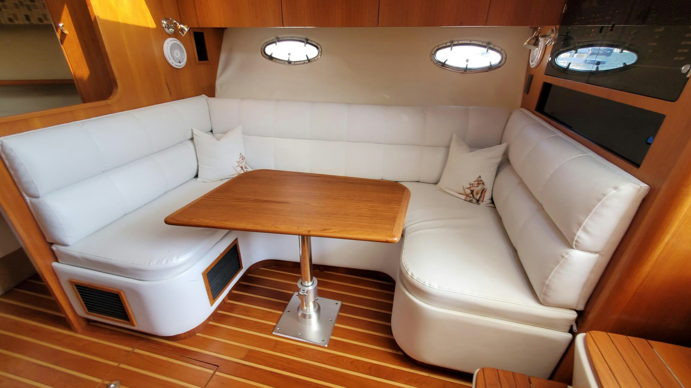 a couch and a coffee table in a room aboard NIMMO Yacht for Sale
