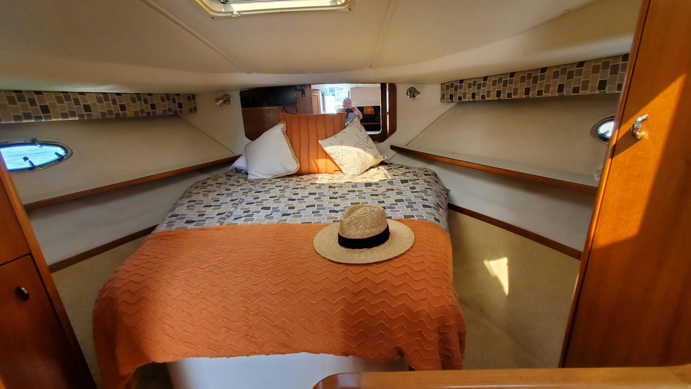 a bed with a hat on it aboard NIMMO Yacht for Sale