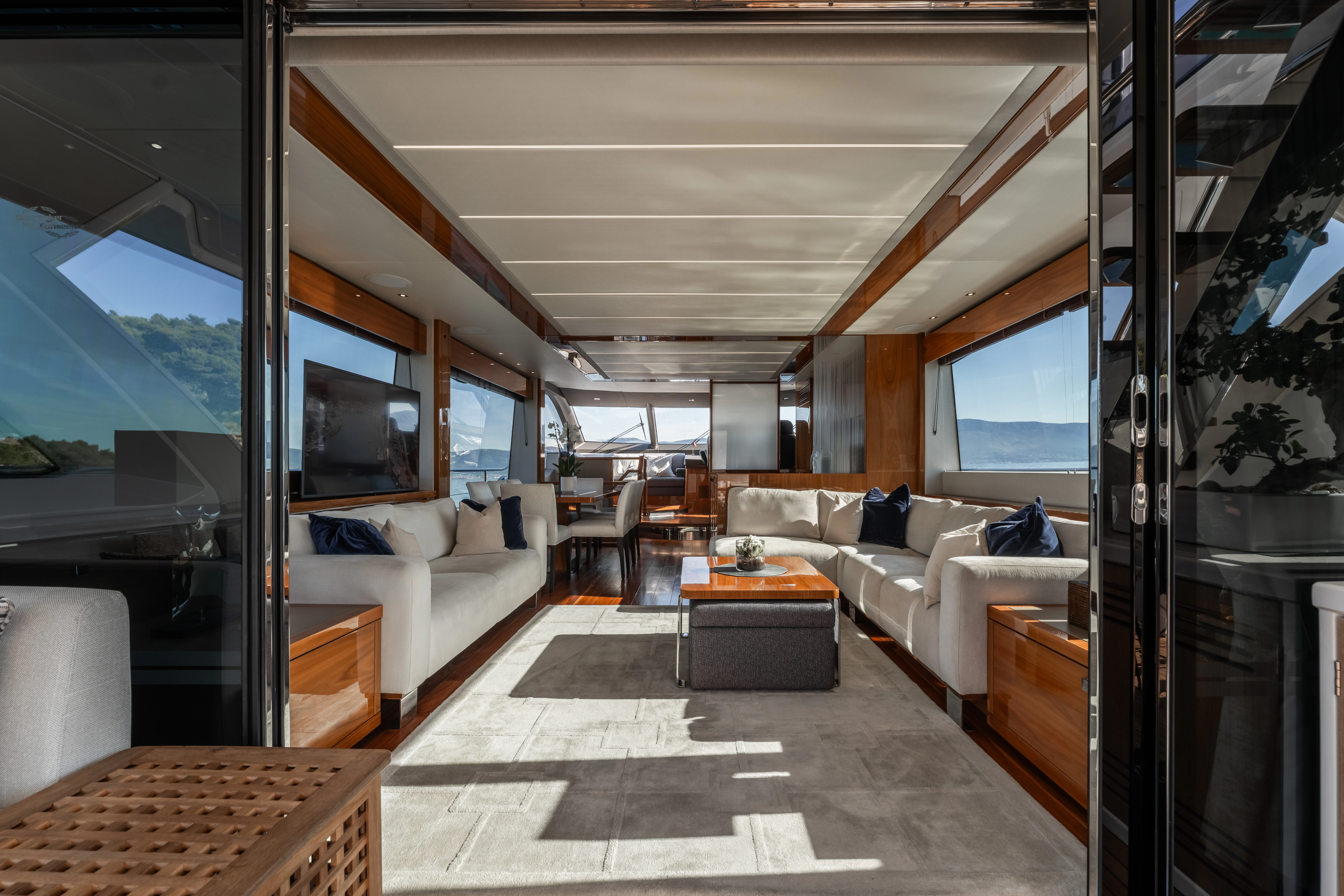 a living room with a large window aboard TOP LEVEL Yacht for Sale