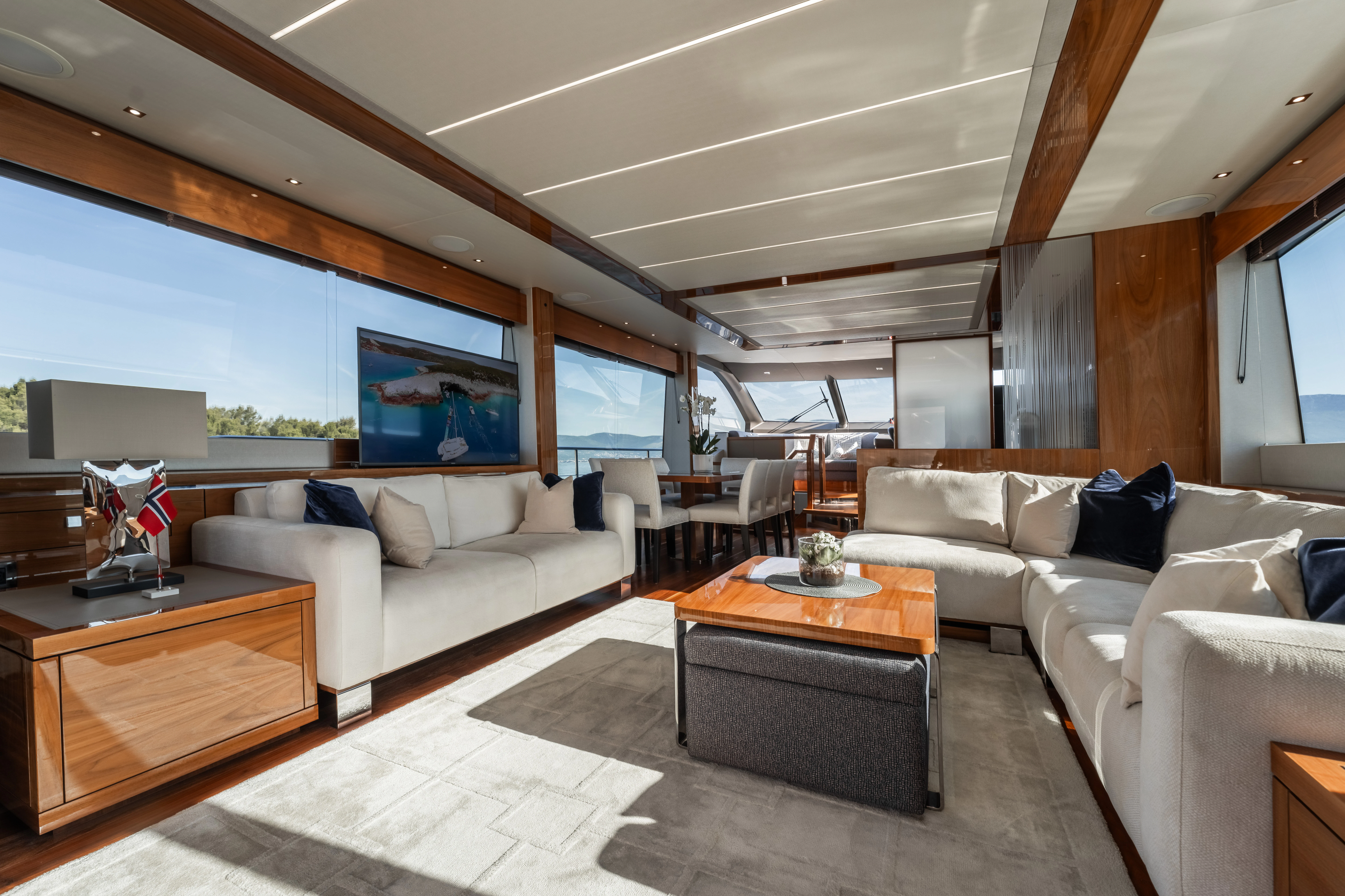 a living room with a large window aboard TOP LEVEL Yacht for Sale
