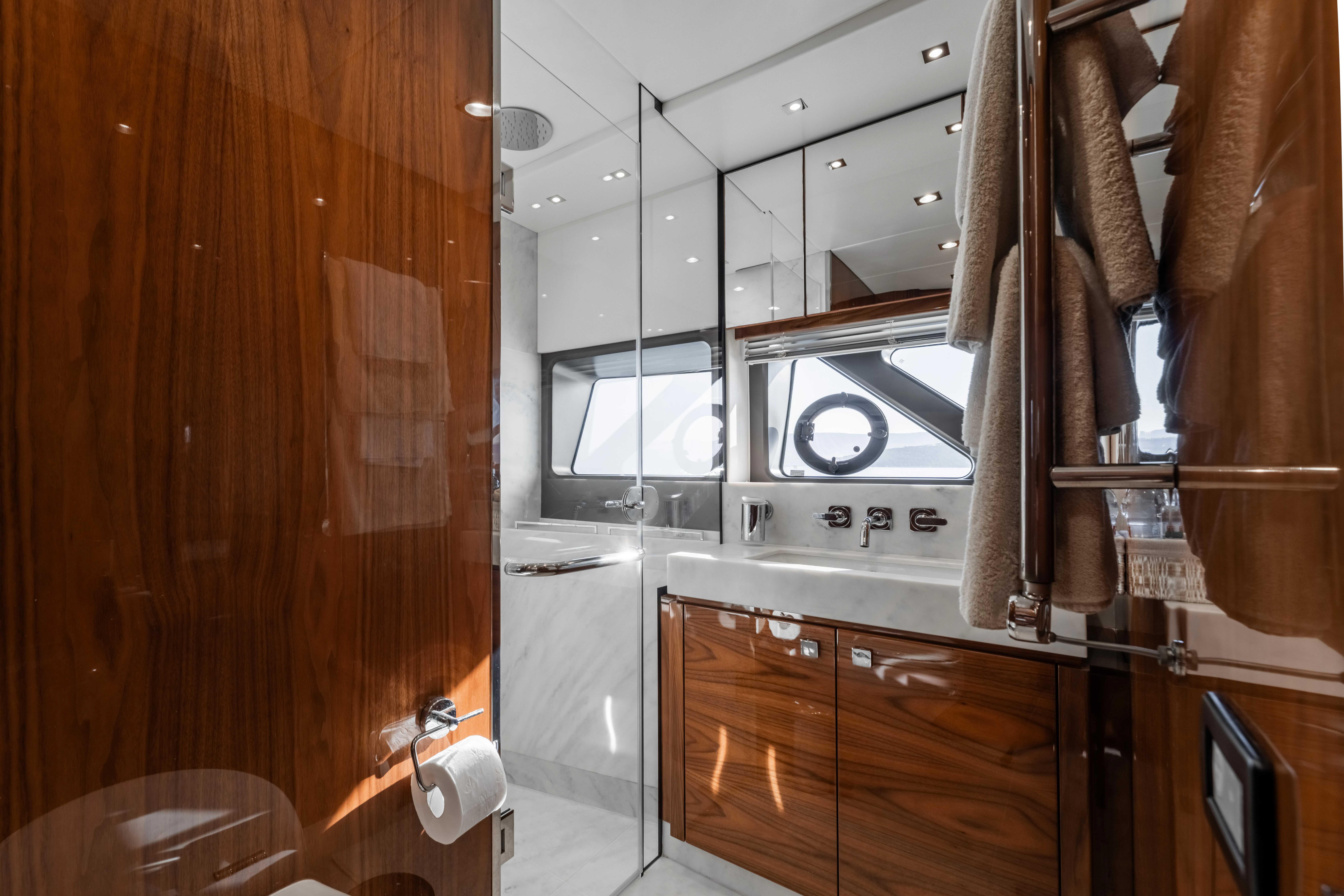a kitchen with wooden cabinets aboard TOP LEVEL Yacht for Sale
