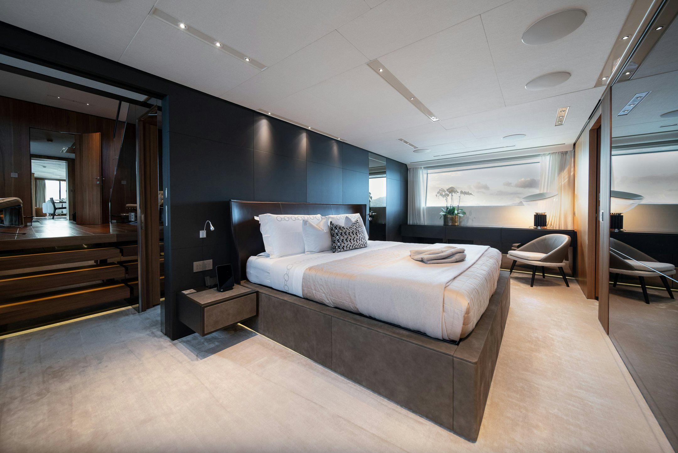 a large bedroom with a large bed aboard AIX Yacht for Charter