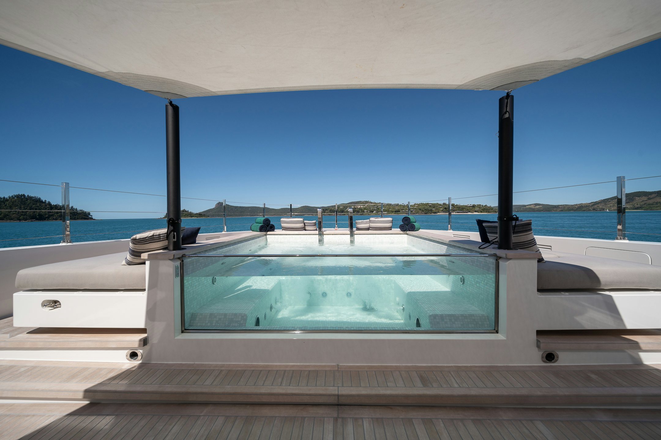 a large white boat on a dock aboard AIX Yacht for Charter