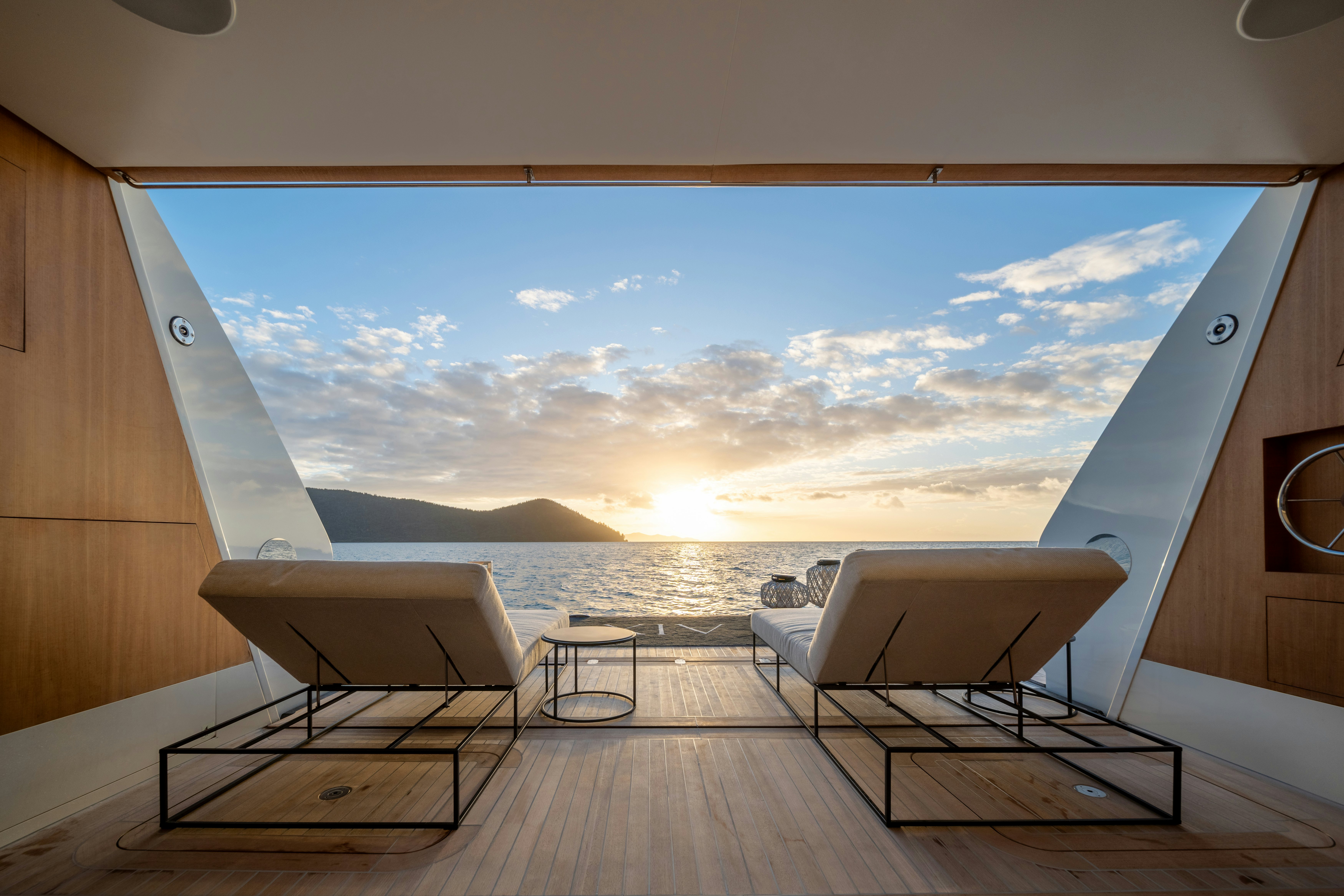 a room with a view of the ocean and a large window aboard AIX Yacht for Charter