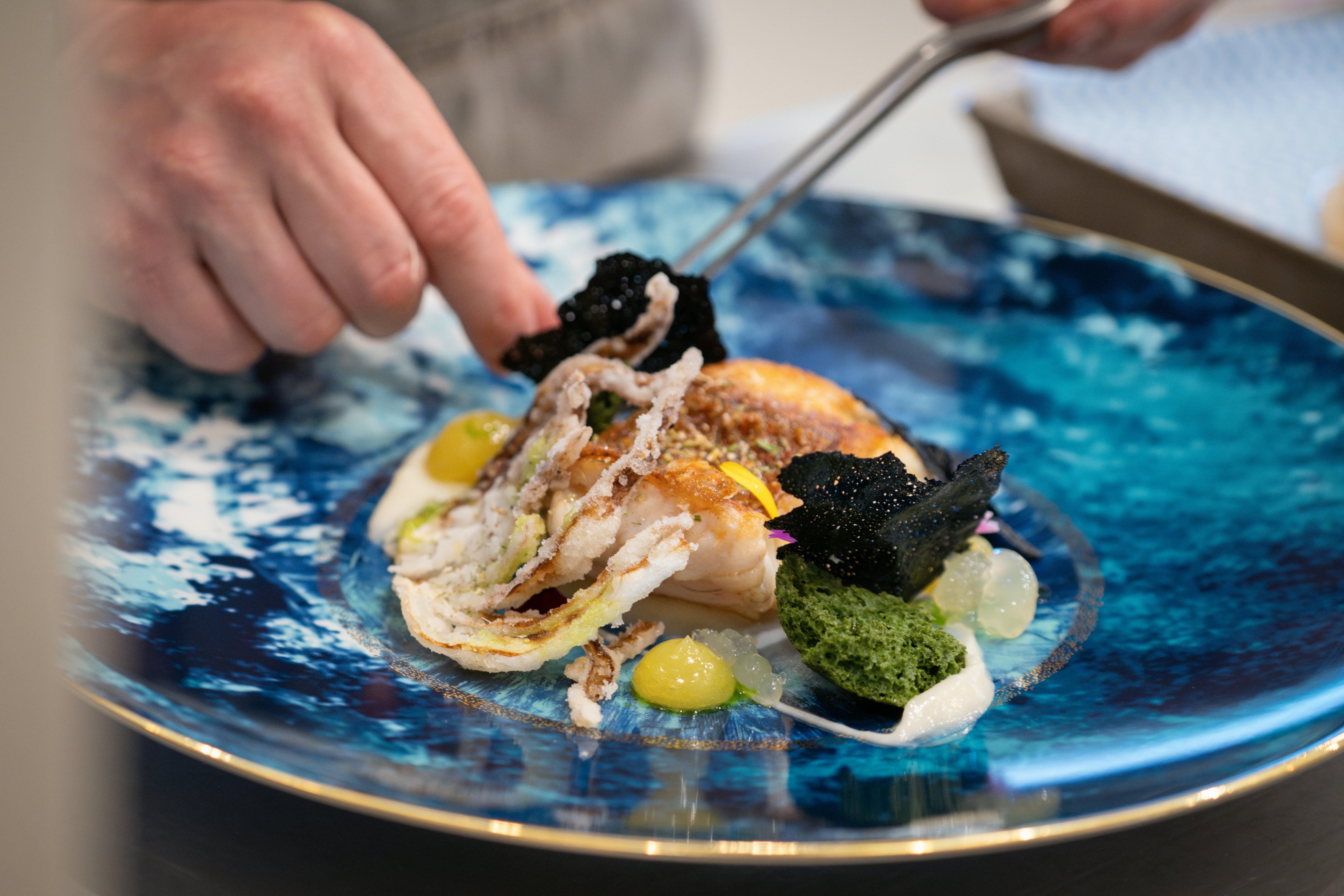 a plate of food aboard AIX Yacht for Charter